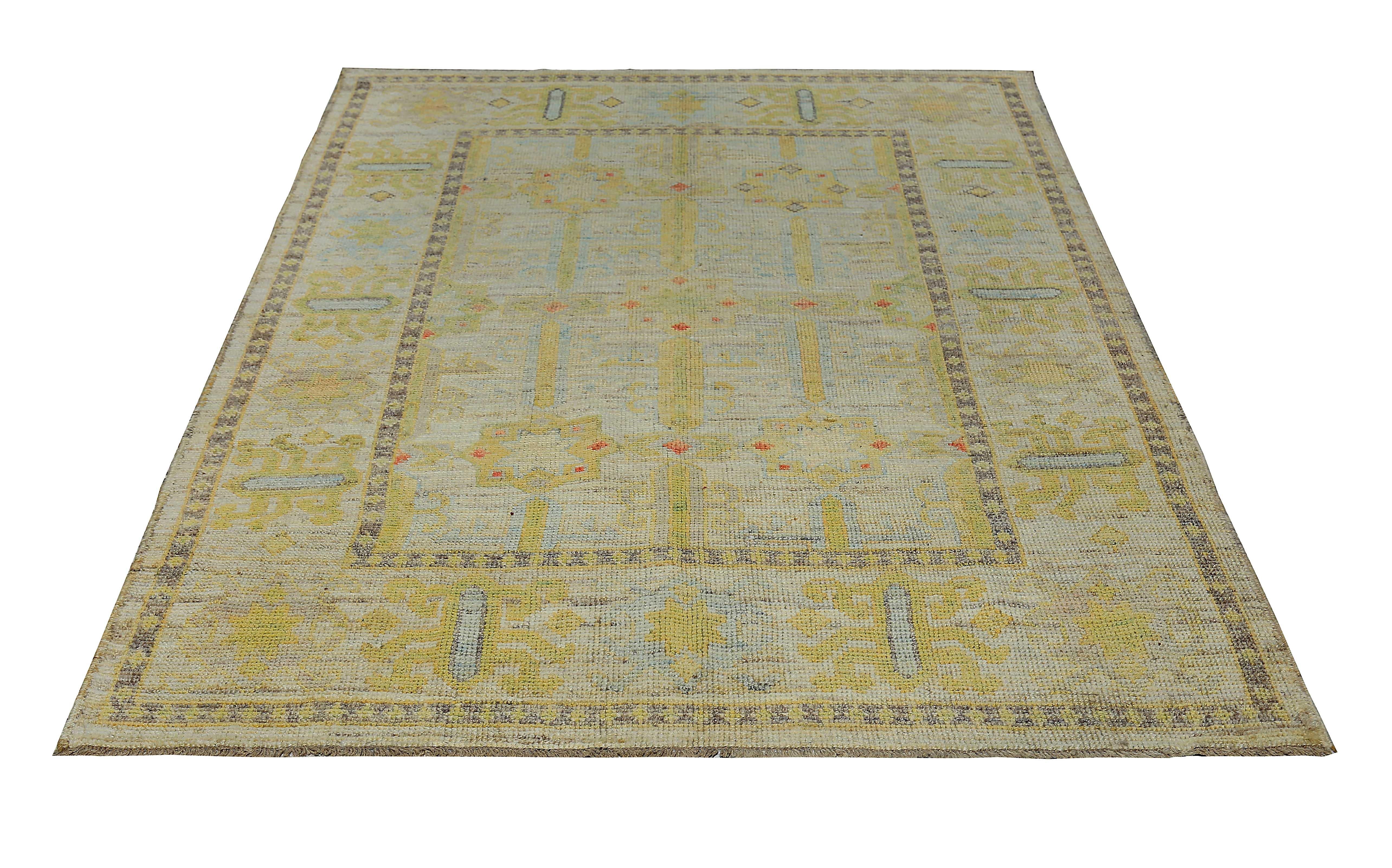 New Turkish rug made of handwoven sheep’s wool of the finest quality. It’s colored with organic vegetable dyes that are certified safe for humans and pets alike. It features gold and gray floral medallions on a Fine ivory field. Flower patterns are