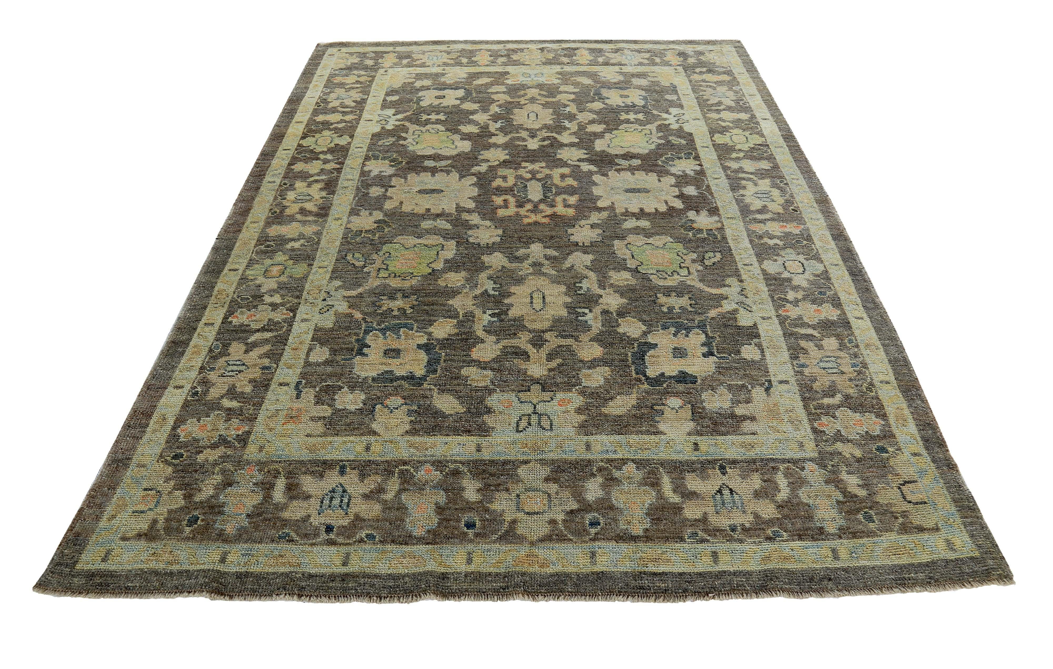 Turkish rug made of handwoven sheep’s wool of the finest quality. It’s colored with organic vegetable dyes that are certified safe for humans and pets alike. It features green, blue and beige flower heads on a beautiful brown field. Flower patterns
