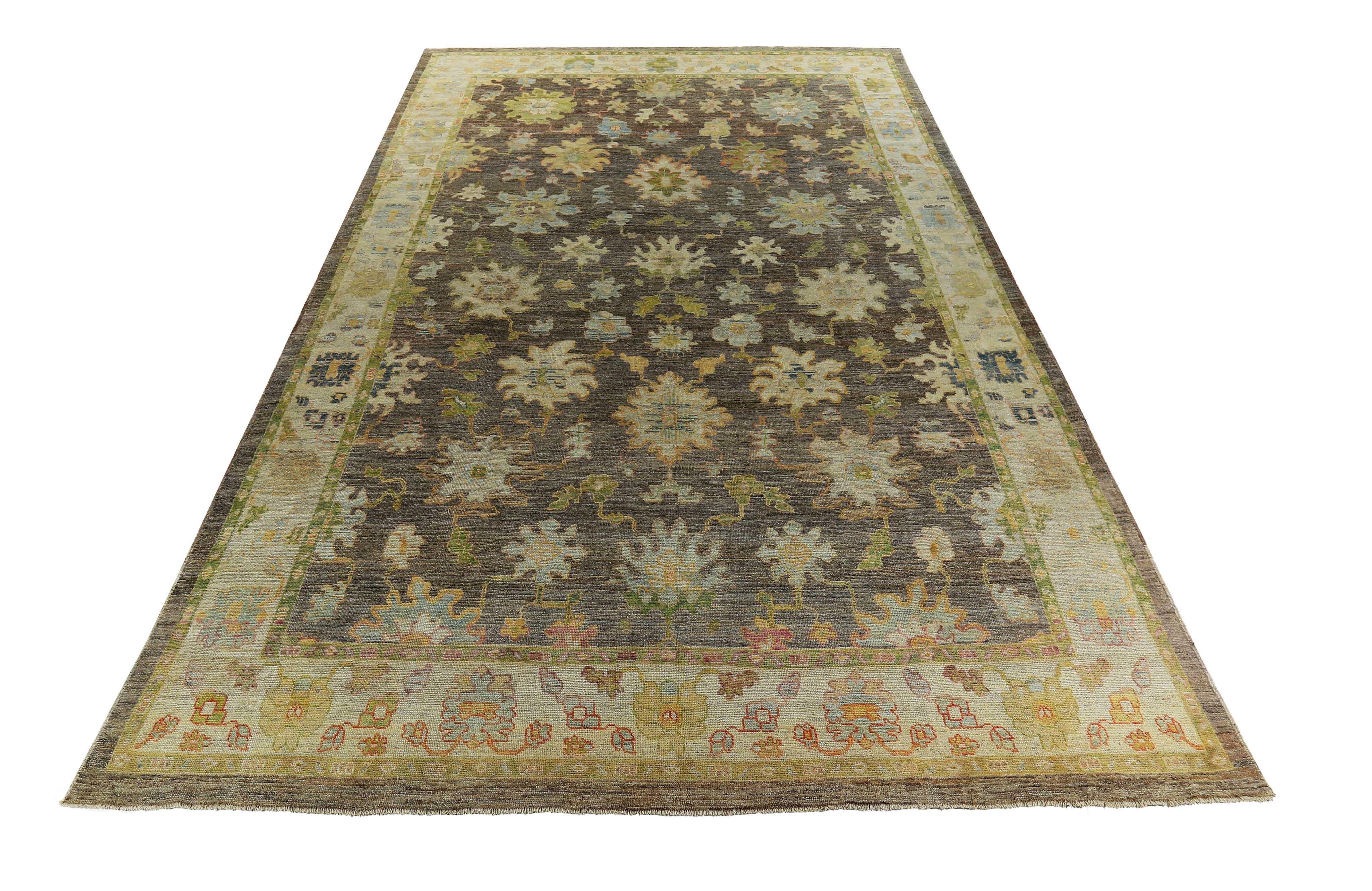 New Turkish rug made of handwoven sheep’s wool of the finest quality. It’s colored with organic vegetable dyes that are certified safe for humans and pets alike. It features green and blue floral details on a lovely brown and ivory field. Flower