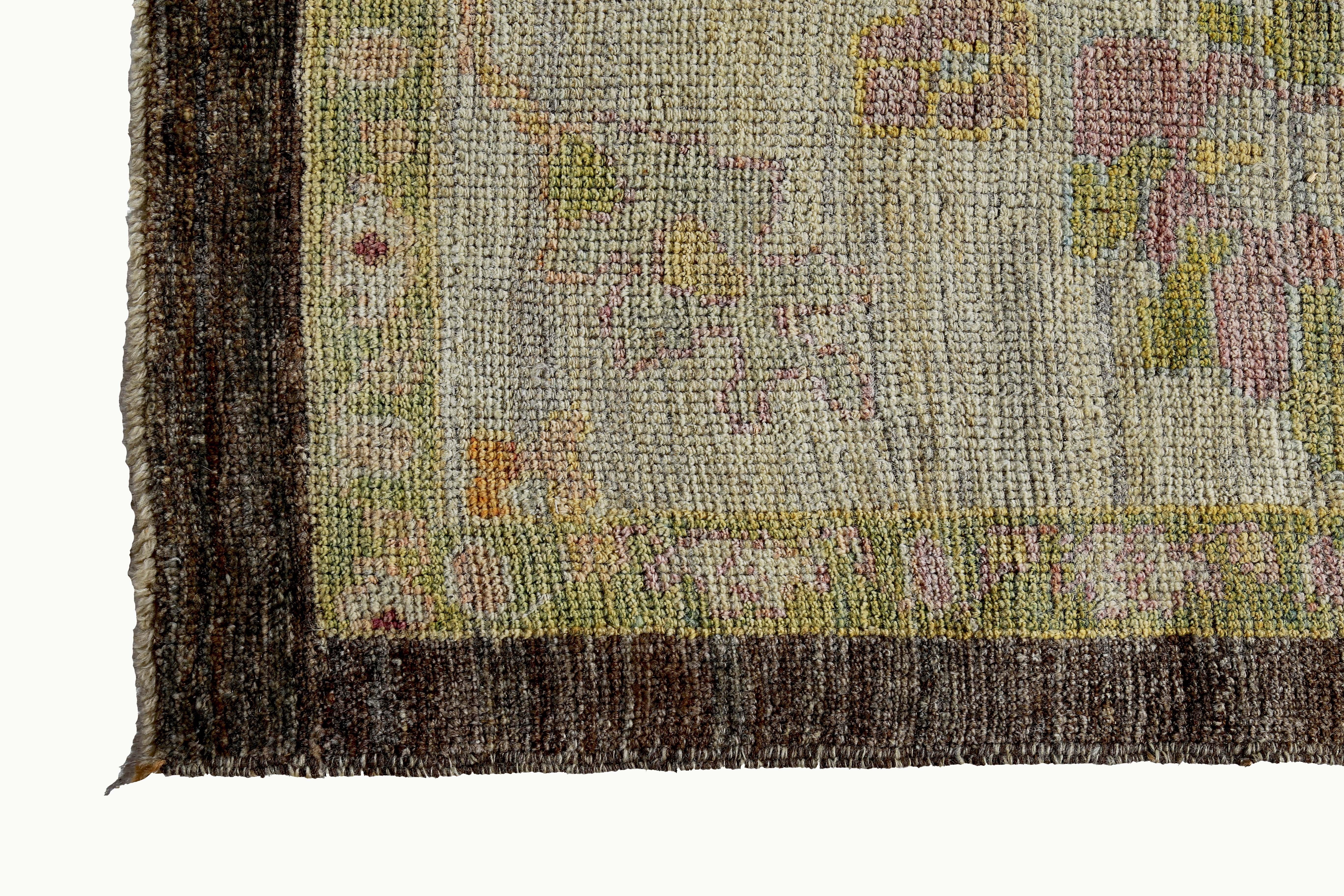 Wool Turkish Oushak Rug with Green and Blue Floral Details on Ivory and Brown Field For Sale