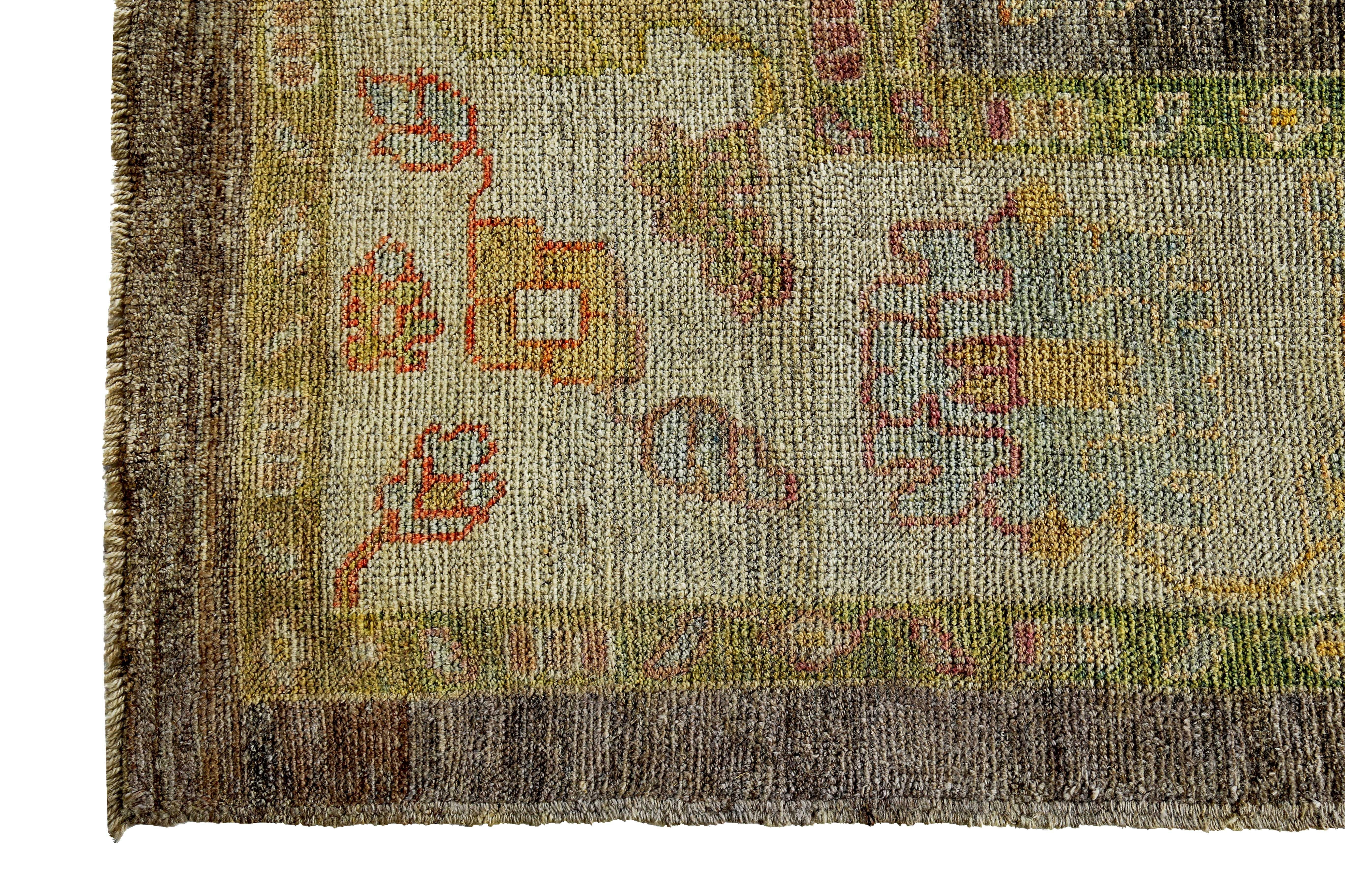 Turkish Oushak Rug with Green and Blue Floral Details on Ivory and Brown Field For Sale 1