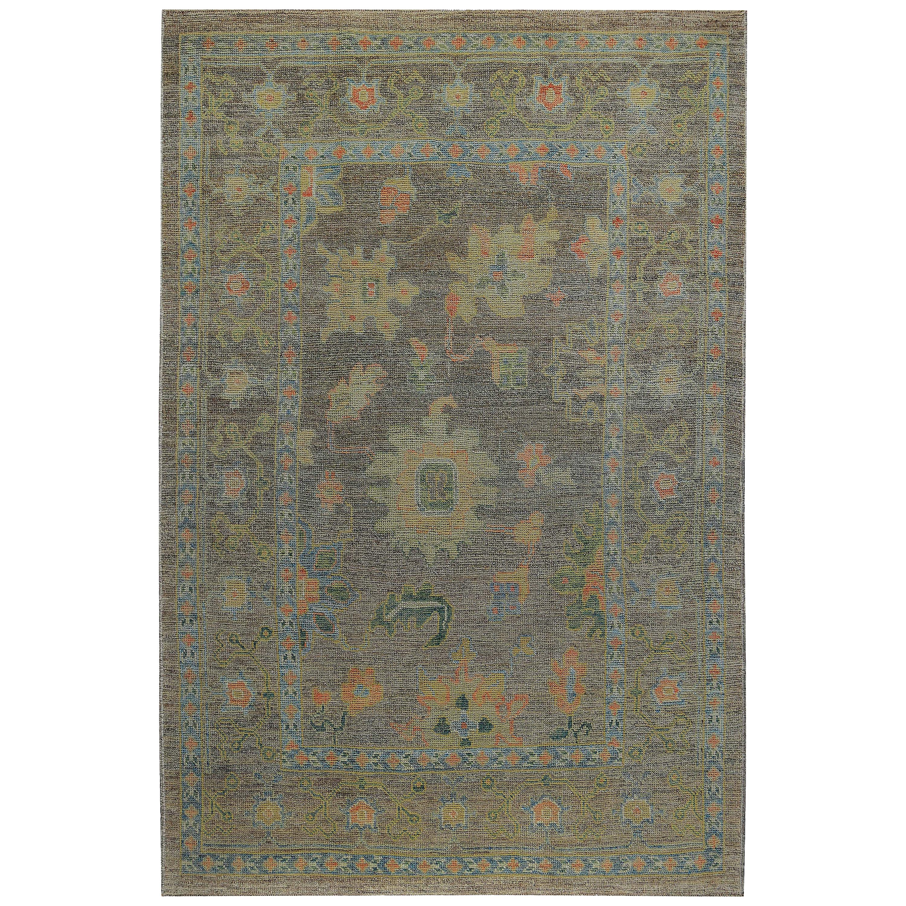 New Turkish rug made of handwoven sheep’s wool of the finest quality. It’s colored with organic vegetable dyes that are certified safe for humans and pets alike. It features green and pink floral details on a lovely brown field. Flower patterns are