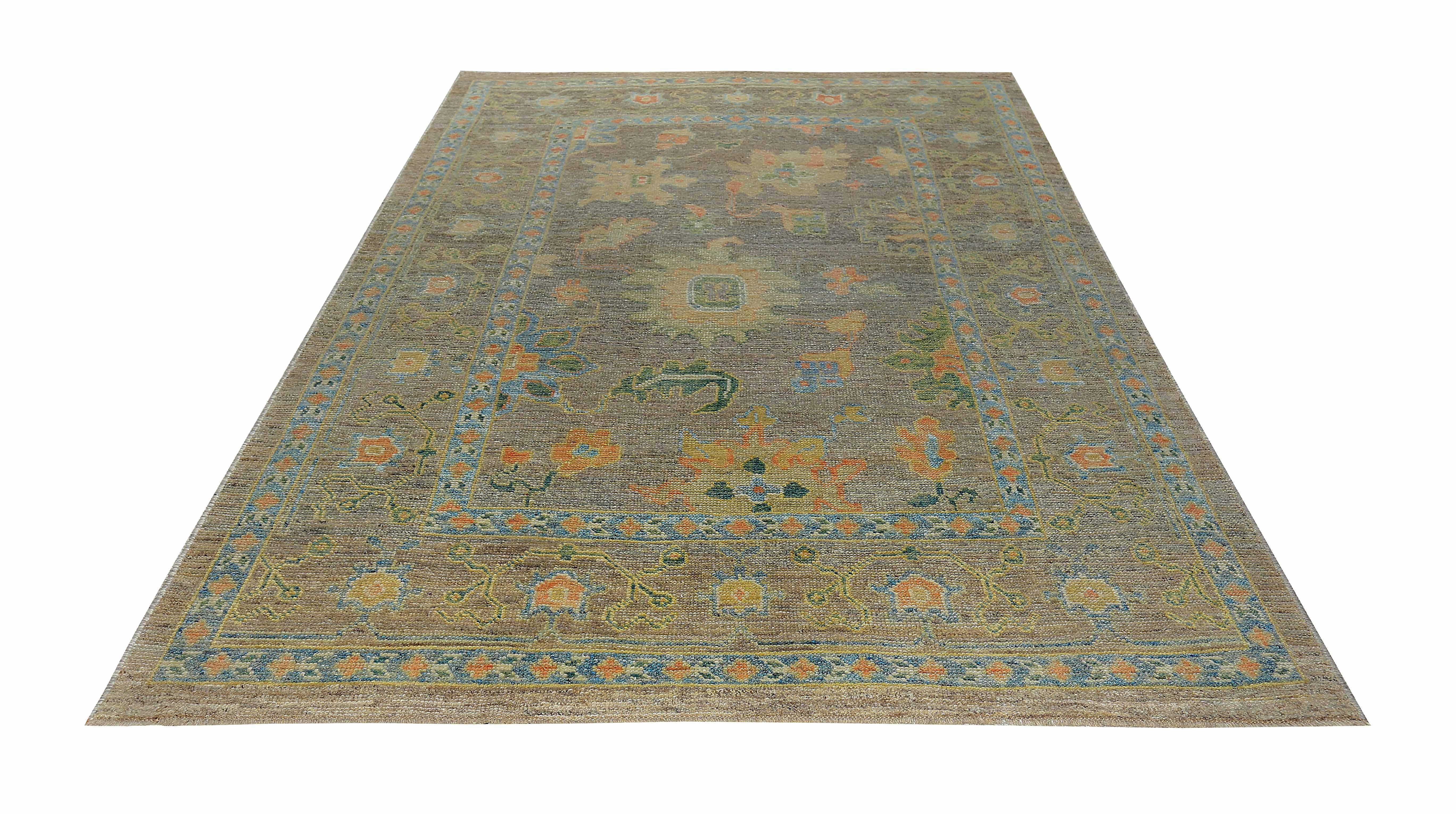 Hand-Woven Turkish Oushak Rug with Green and Pink Floral Details on Brown Field For Sale