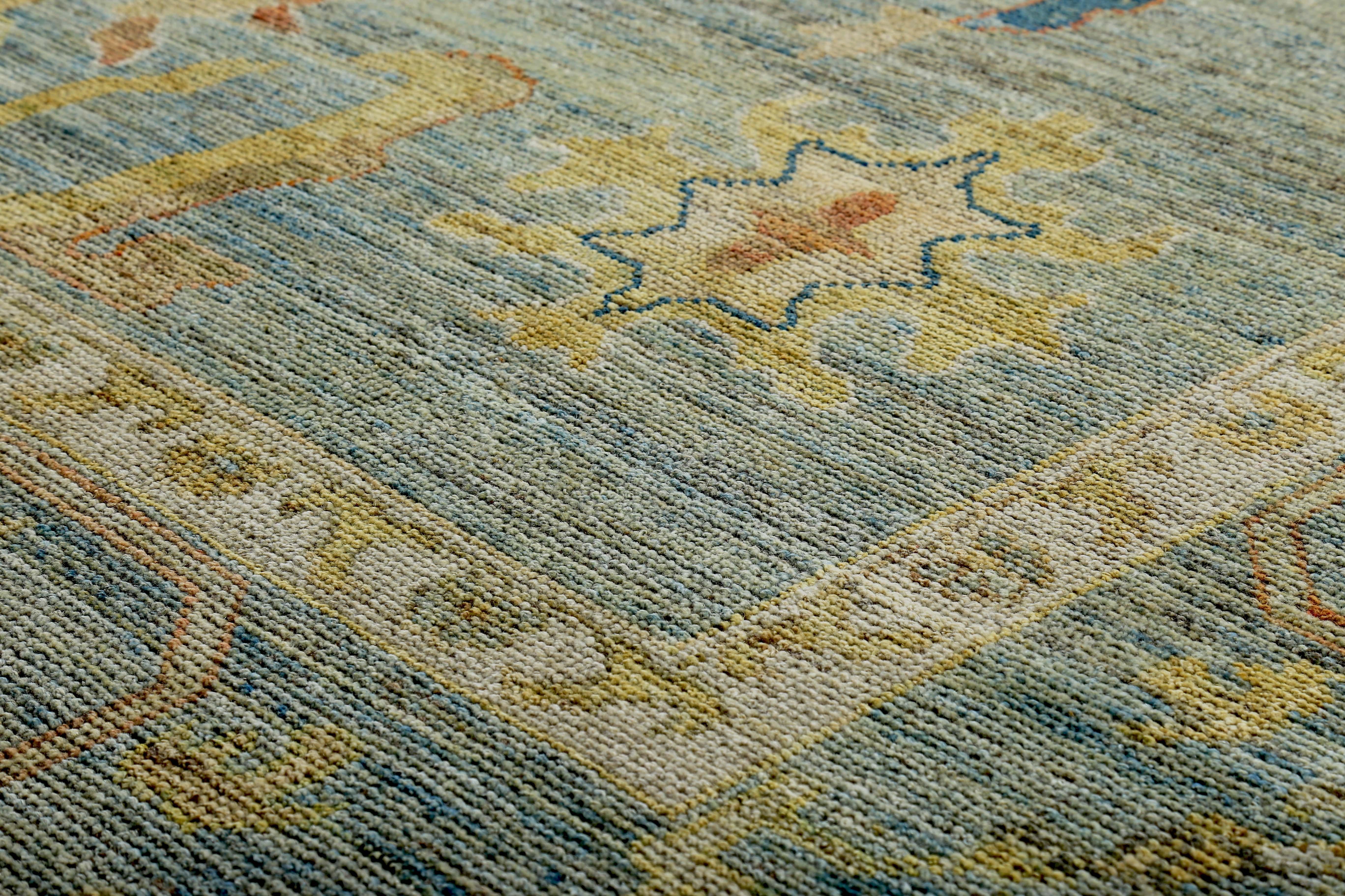 Hand-Woven Turkish Oushak Rug with Ivory & Gold Floral Details on Blue Field For Sale