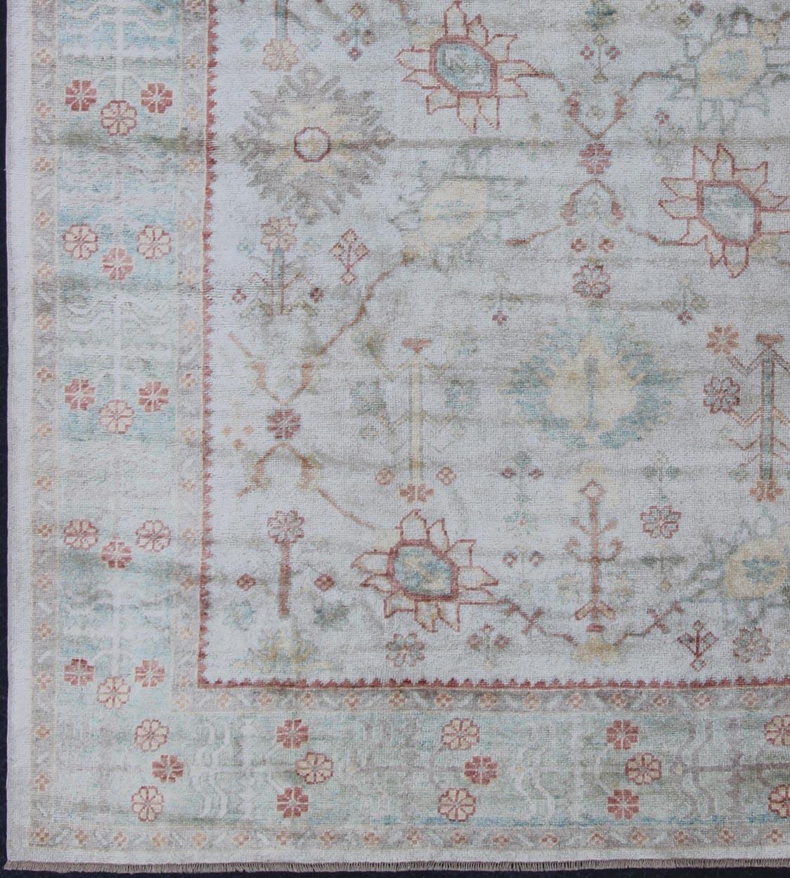 Keivan Woven Arts, En-3264, Turkish Oushak Rug- 9′4″ × 11′4″
This traditional Oushak rug from Turkey features a subdued, neutral color palette and an all-over design of floral shapes, surrounded beautifully by an all-encompassing, complementary