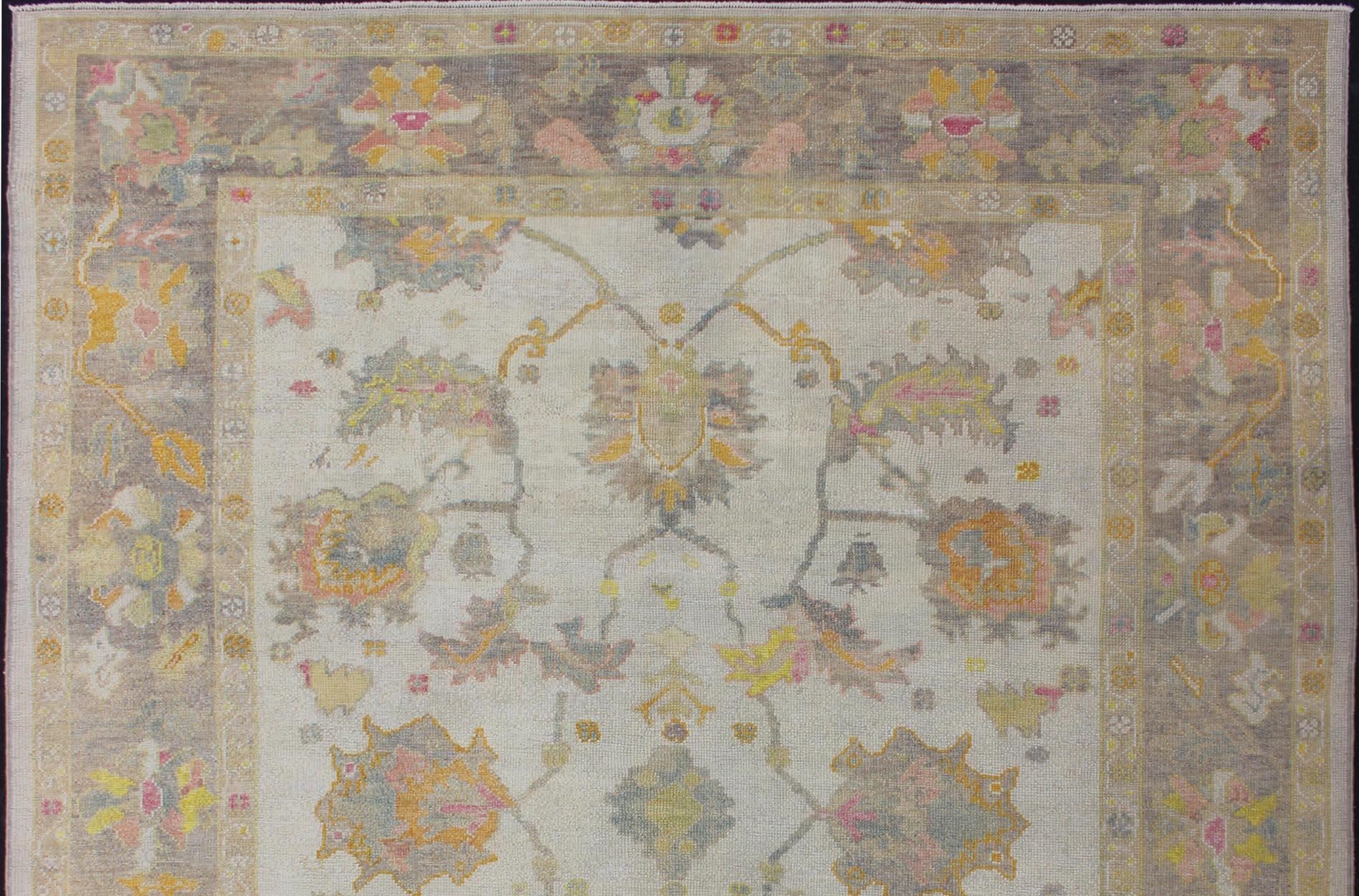 Turkish Oushak rug with array of light and medium tone colors and design, rug EN-176126, country of origin / type: Turkey / Oushak

This traditional Oushak rug from Turkey features a subdued, neutral color palette and an all-over design of floral