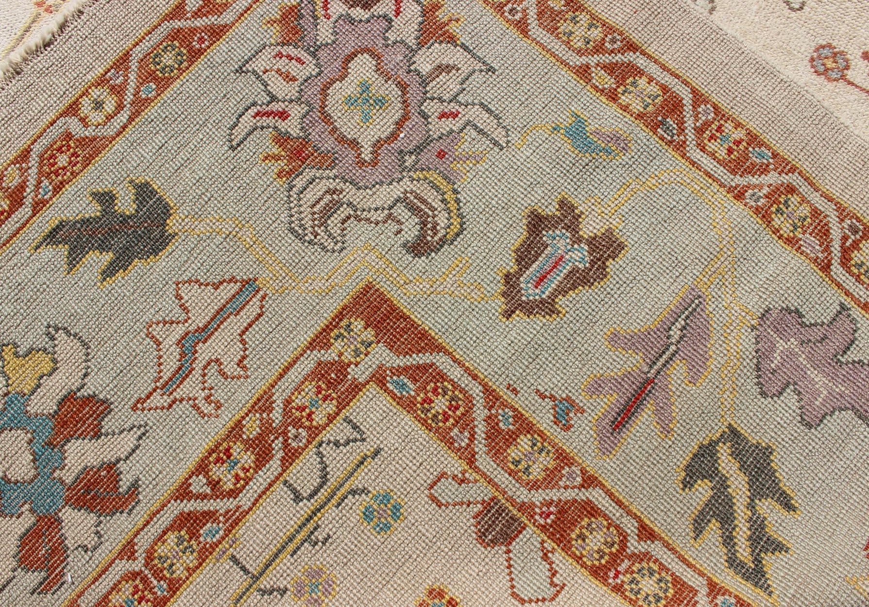 Contemporary Turkish Oushak Rug with Muted Color Palette and All-Over Flower Design For Sale