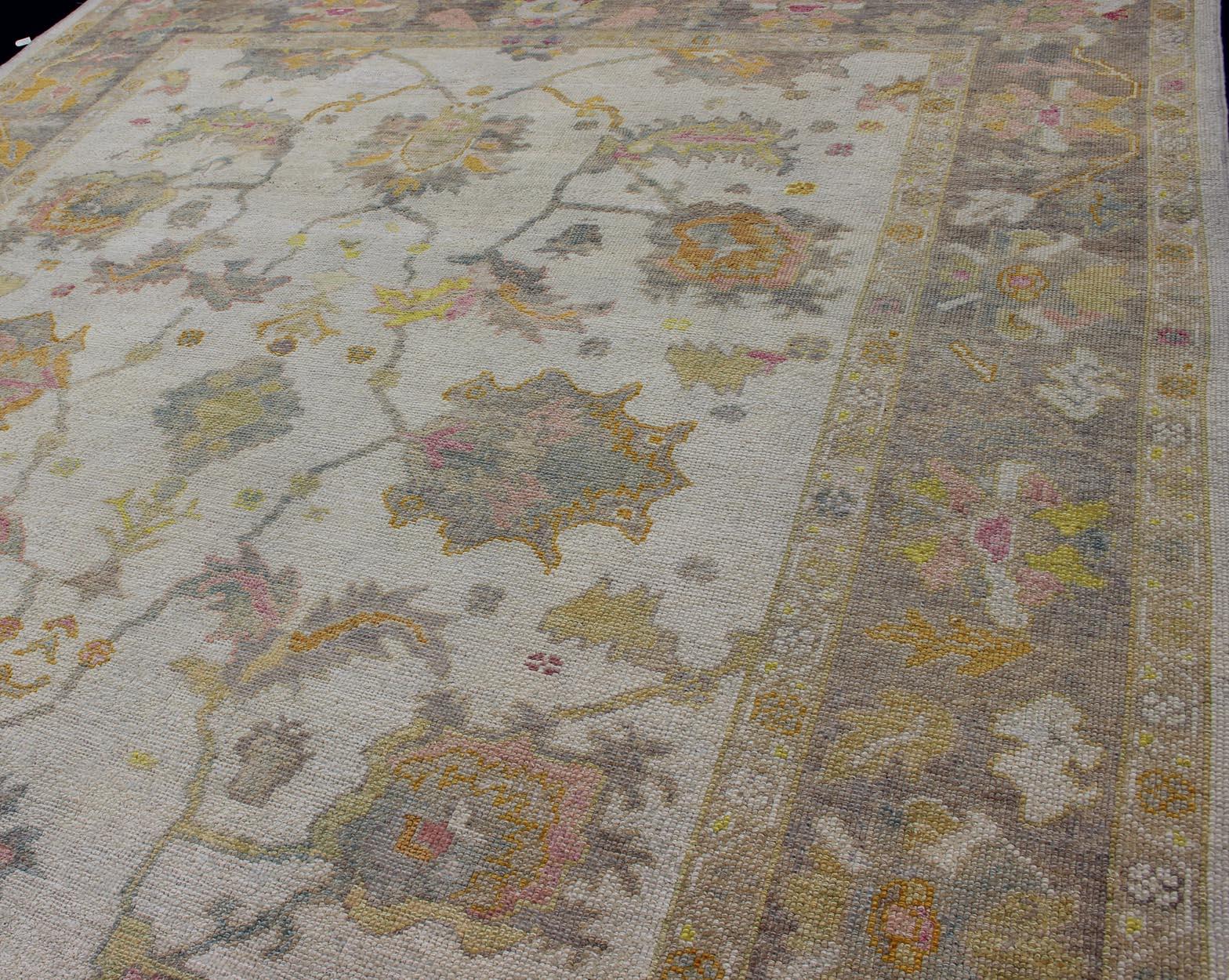 Contemporary Turkish Oushak Rug with Muted Color Palette and All-Over Flower Design For Sale