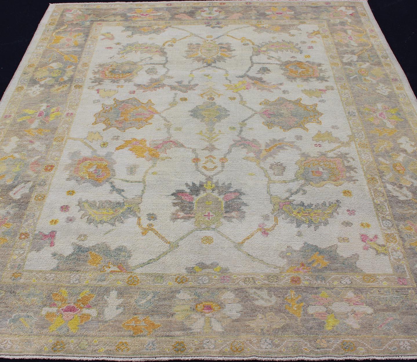 Wool Turkish Oushak Rug with Muted Color Palette and All-Over Flower Design For Sale