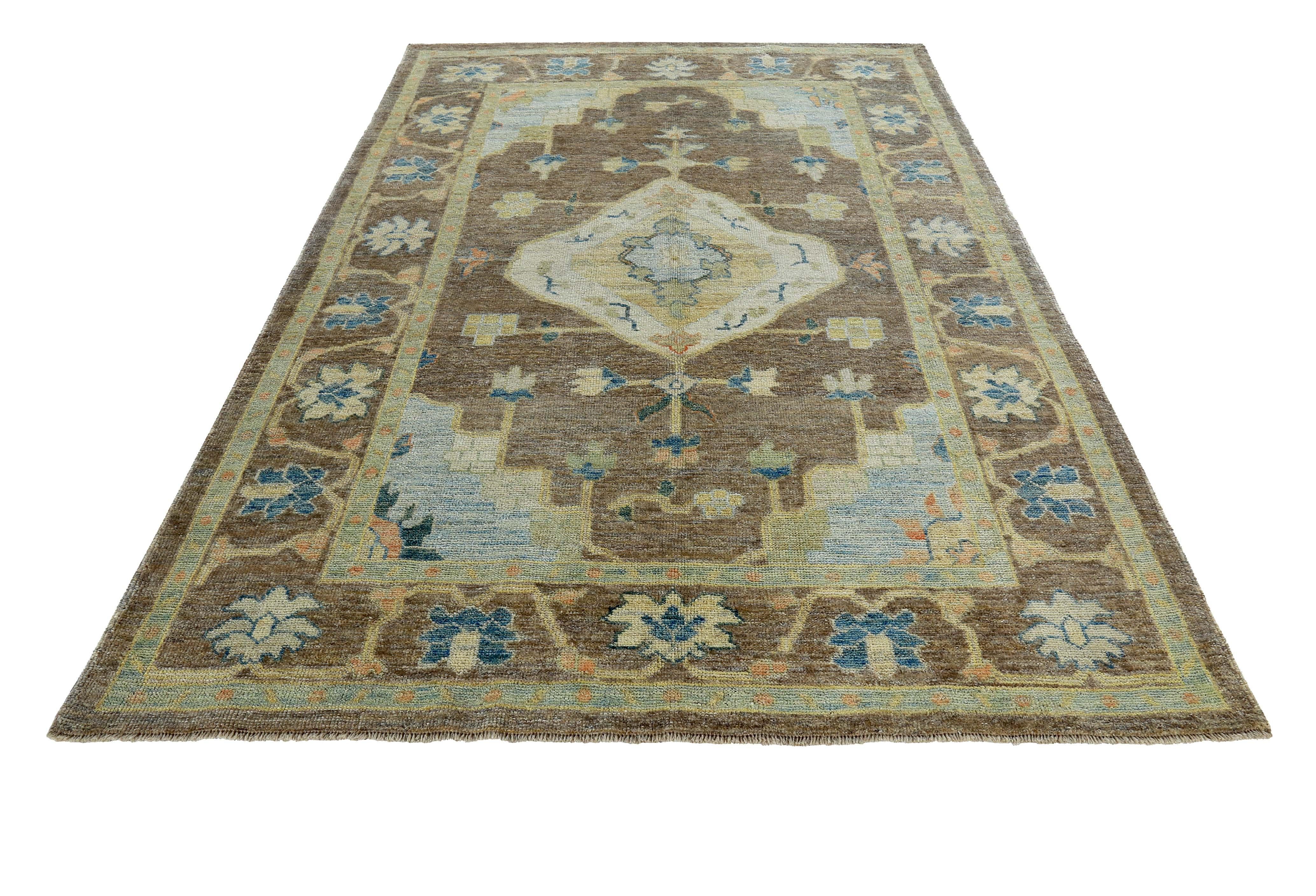 Turkish rug made of handwoven sheep’s wool of the finest quality. It’s colored with organic vegetable dyes that are certified safe for humans and pets alike. It features navy blue and ivory flower heads on a beautiful brown field. Flower patterns