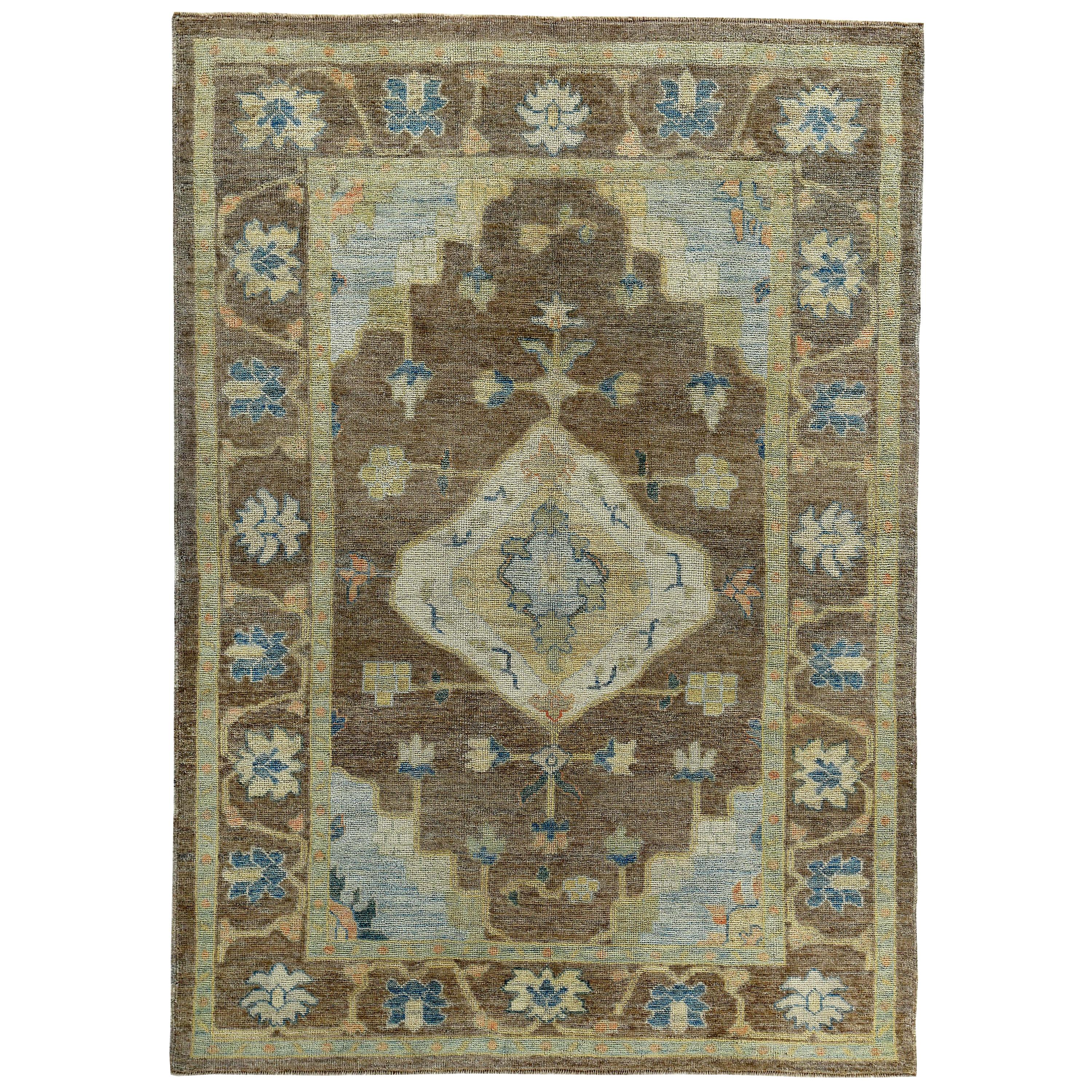 Turkish Oushak Rug with Navy and Ivory Flower Heads on Brown Field For Sale