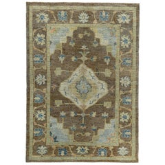 Turkish Oushak Rug with Navy and Ivory Flower Heads on Brown Field