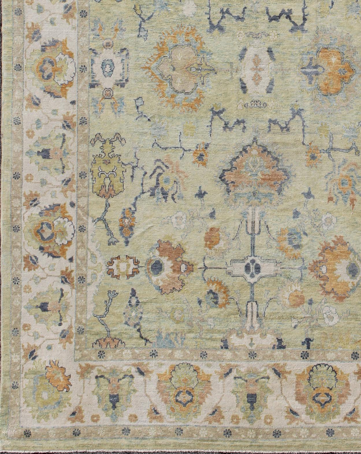 Turkish Oushak rug with neutral color palette and all-over flower design. Keivan Woven Arts /  rug EN-165700, country of origin / type: Turkey / Oushak
Measures: 10'9 x 16'.
This traditional Oushak rug from Turkey features a subdued, neutral color