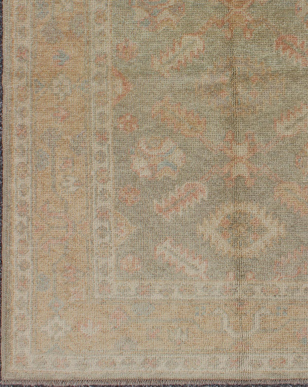 Turkish Oushak rug with neutral color Palette and All-Over flower design, rug en-345, country of origin / type: Turkey / Oushak.

This traditional Oushak rug from Turkey features a subdued, neutral color palette and an all-over design of floral