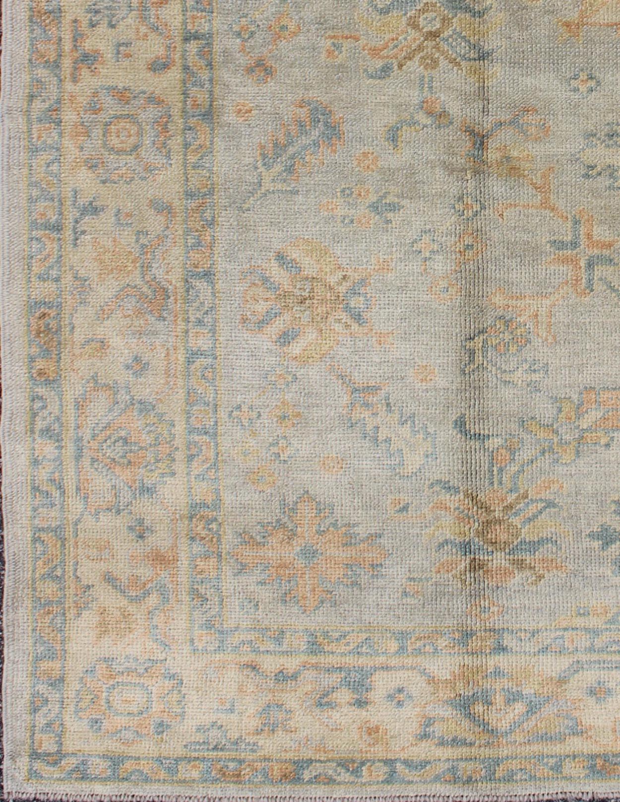 Turkish Oushak rug with neutral color palette and all-over flower design, rug en-842, country of origin / type: Turkey / Oushak

This traditional Oushak rug from Turkey features a subdued, neutral color palette and an all-over design of floral