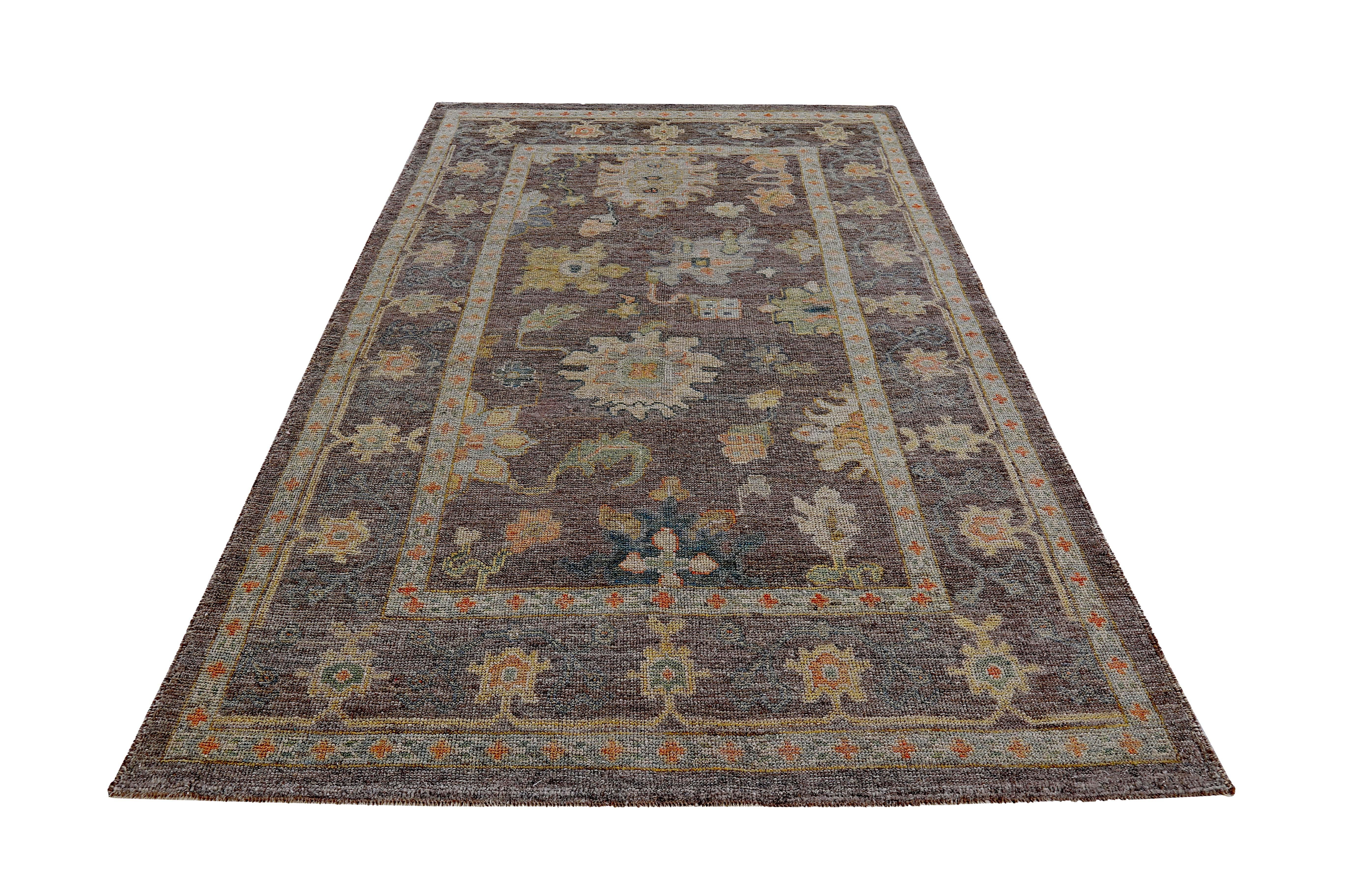 Turkish rug made of handwoven sheep’s wool of the finest quality. It’s colored with organic vegetable dyes that are certified safe for humans and pets alike. It features orange green and blue flower heads on a beautiful brown field. Flower patterns