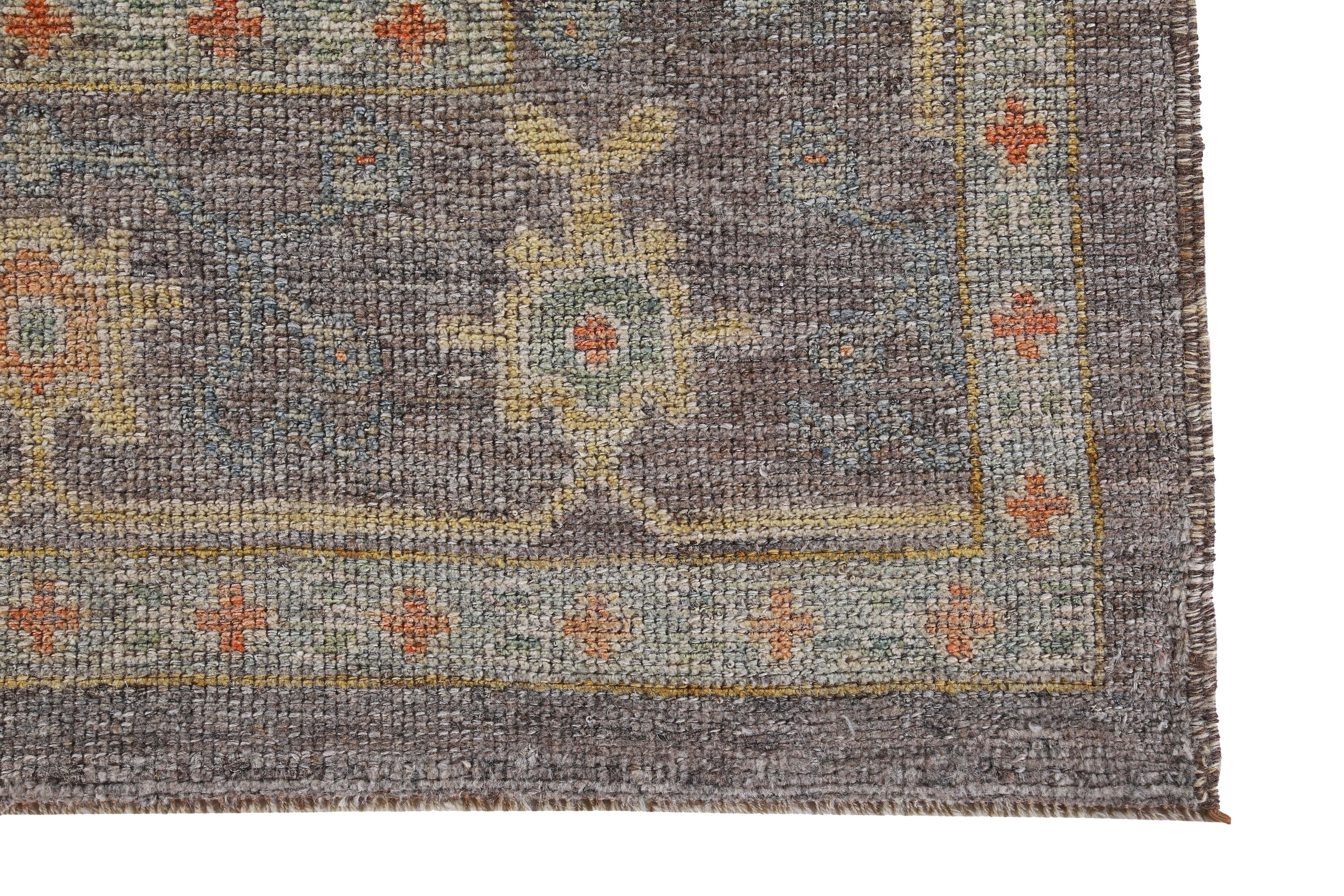 Contemporary Turkish Oushak Rug with Orange, Green and Blue Flower Heads on Brown Field For Sale