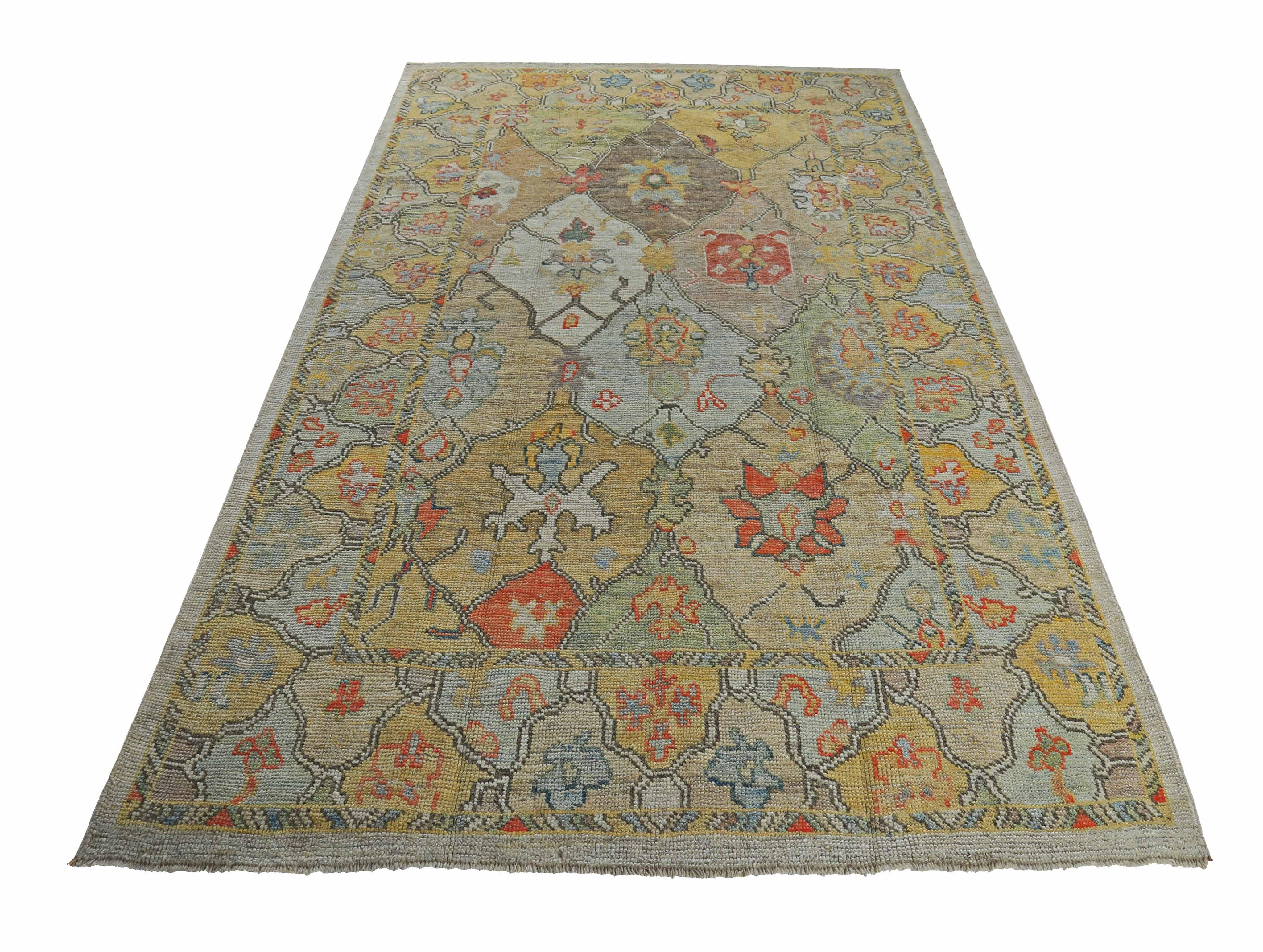New Turkish rug made of handwoven sheep’s wool of the finest quality. It’s colored with organic vegetable dyes that are certified safe for humans and pets alike. It features orange and gold floral details on an ivory field. Flower patterns are