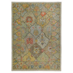 Turkish Oushak Rug with Orange and Yellow Floral Details on Ivory Field