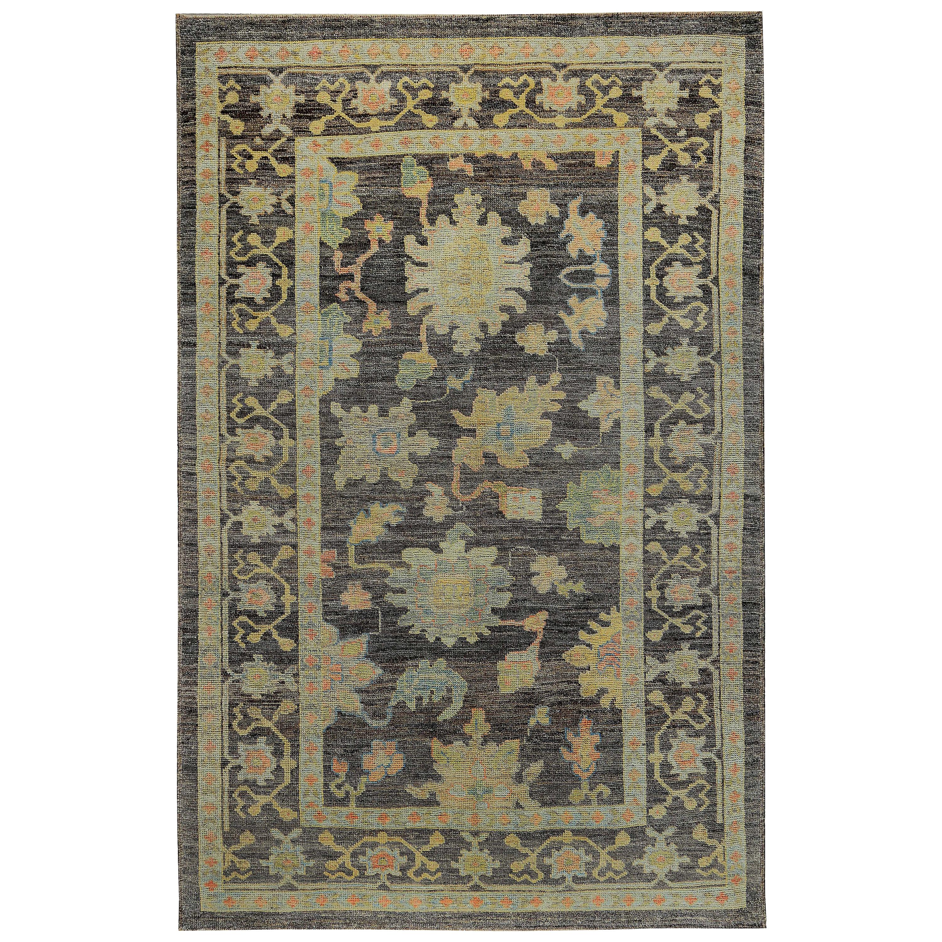 Turkish Oushak Rug with Pink and Gold Floral Details on Brown Field