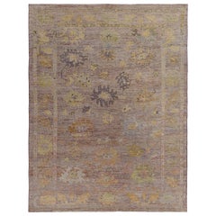 Turkish Oushak Rug with Yellow, Blue and Green Flower Heads on Brown Field