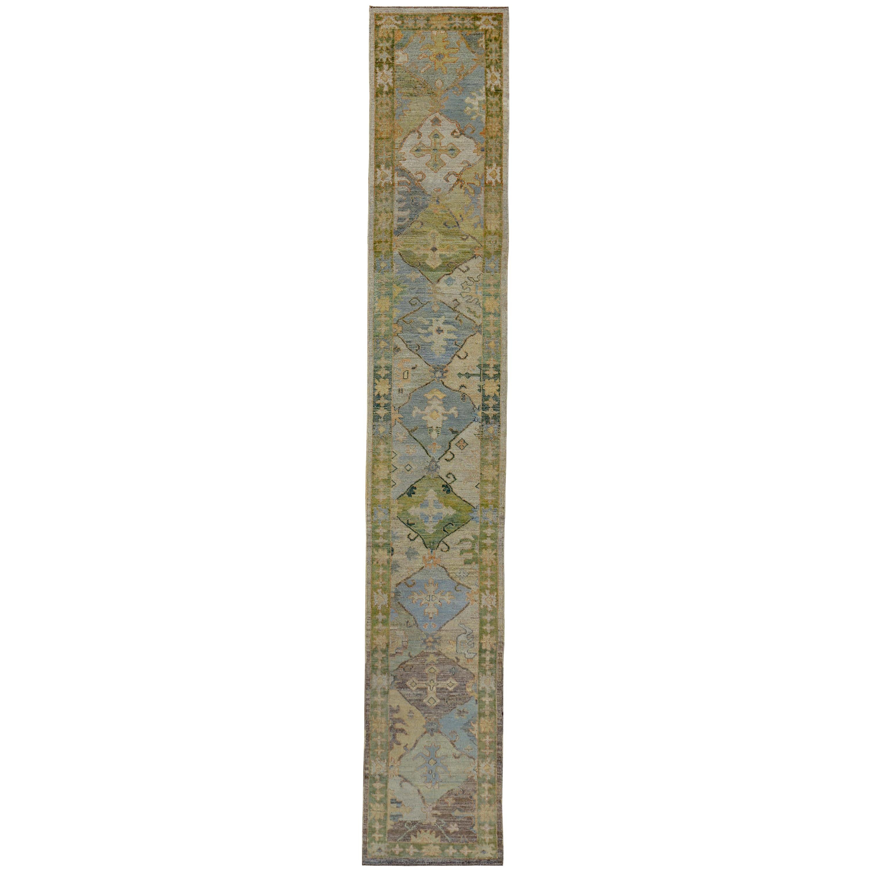 Turkish Oushak Runner Rug with Blue Floral Patterns on Brown and Green Field For Sale