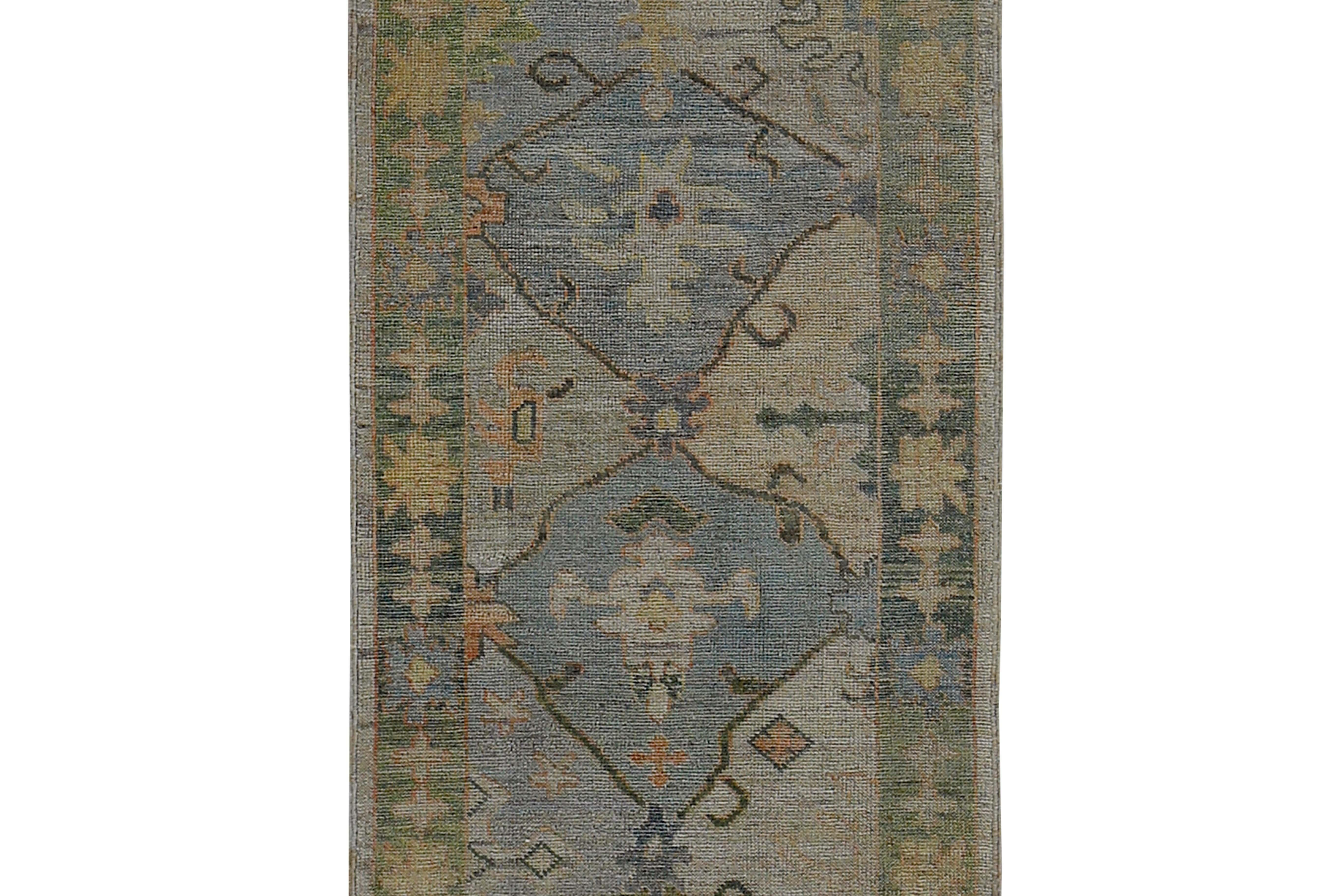 Hand-Woven Turkish Oushak Runner Rug with Blue Floral Patterns on Brown and Green Field For Sale