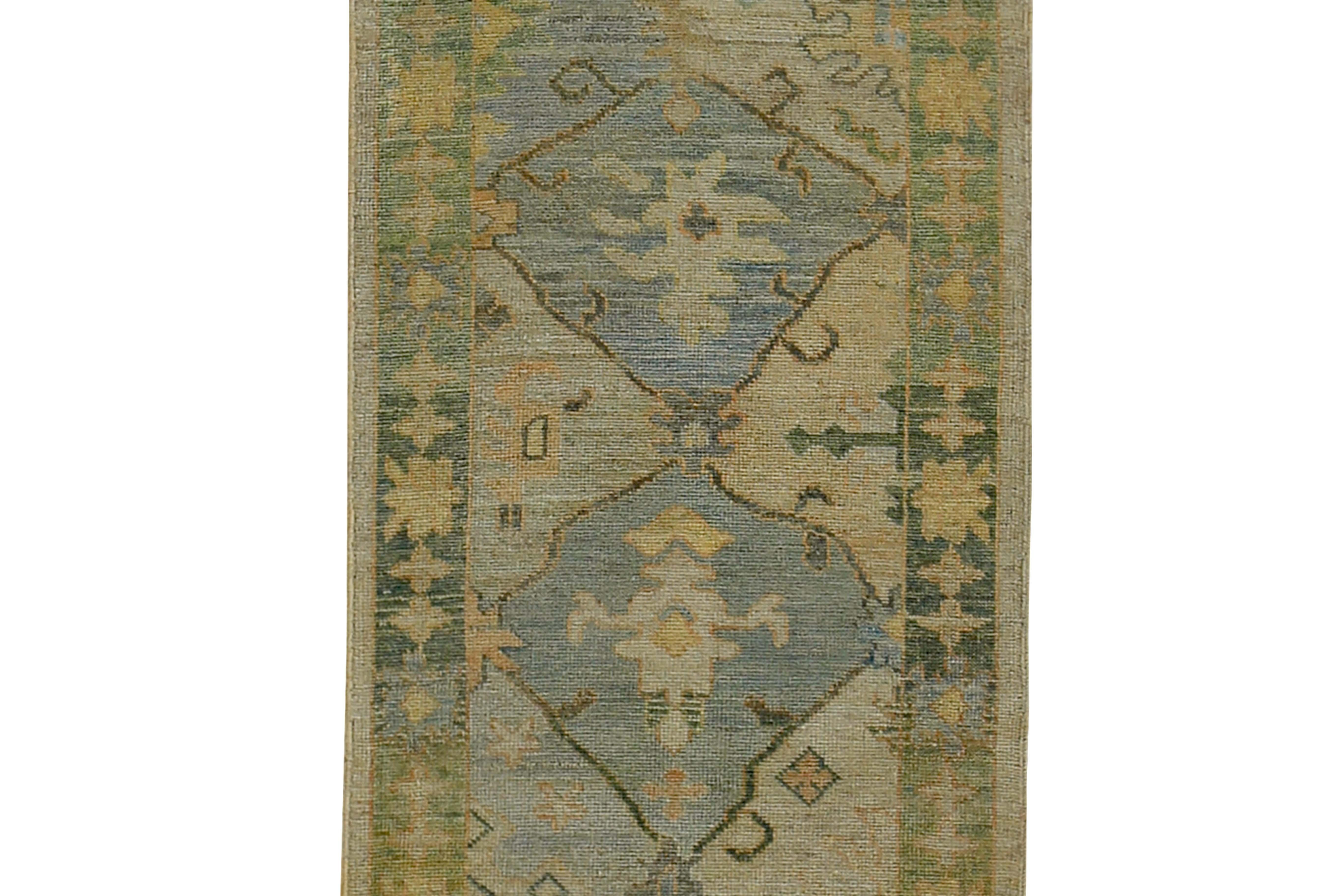 Hand-Woven Turkish Oushak Runner Rug with Blue Floral Patterns on Brown and Green Field For Sale