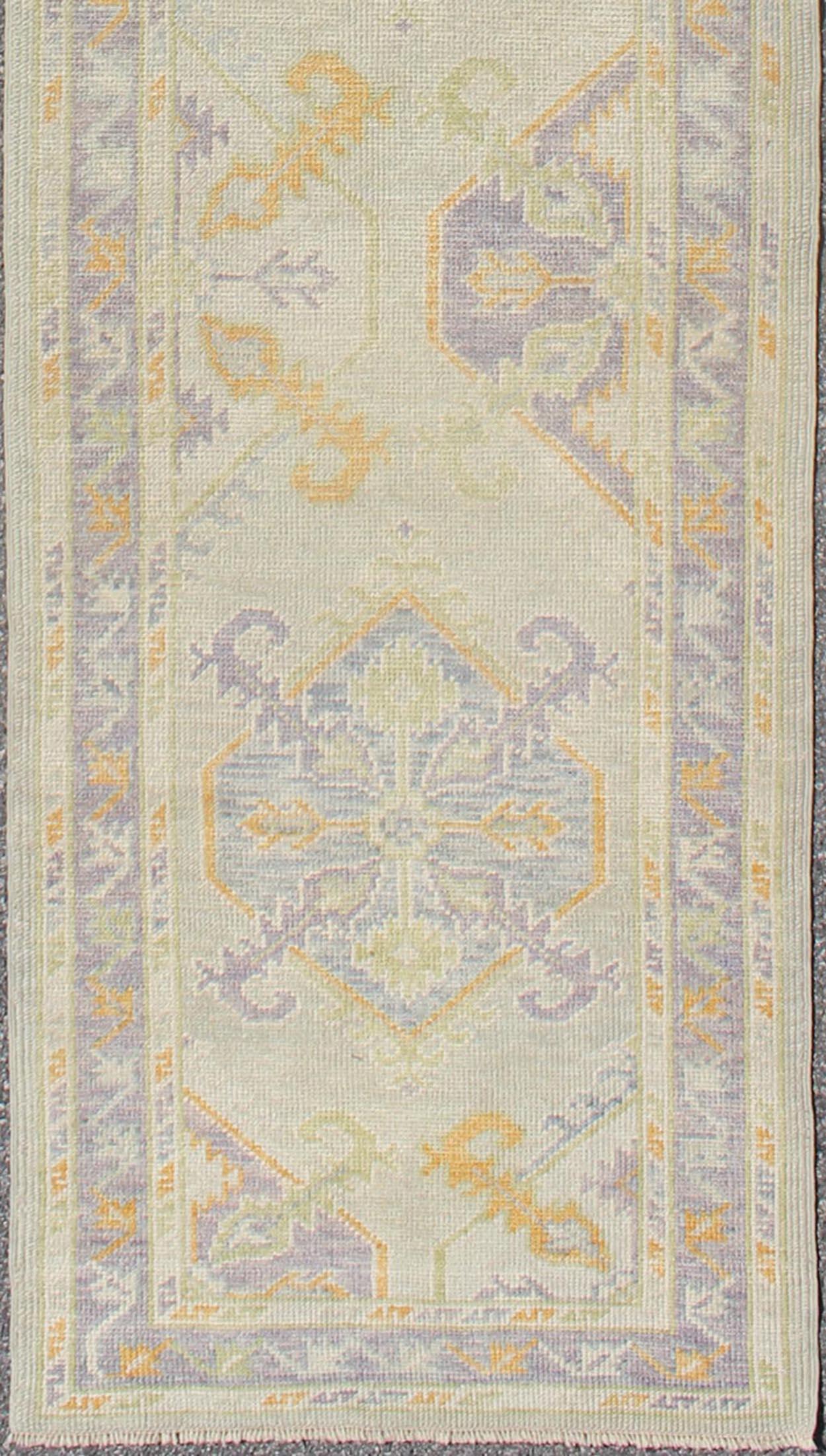 Turkish Oushak runner with purple, blue and L.Green colors and all-over Tribal design. Keivan Woven Arts / rug EN-165660, country of origin / type: Turkey / Oushak
Measures: 2'8 x 12'9.
This traditional Oushak runner from Turkey features a subdued,