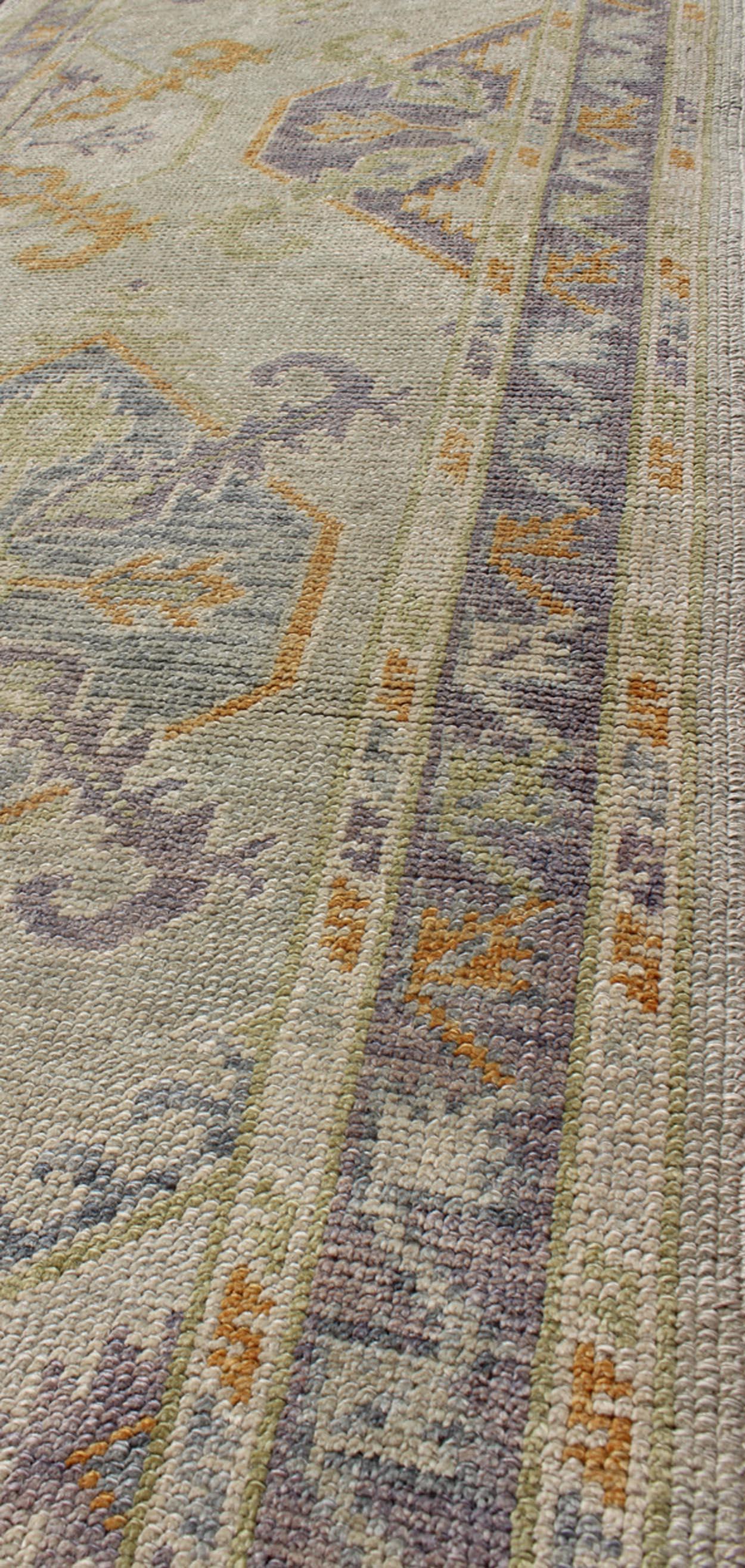 Contemporary Turkish Oushak Runner with a Tribal Design in Purple, Blue and L.Green Colors  For Sale