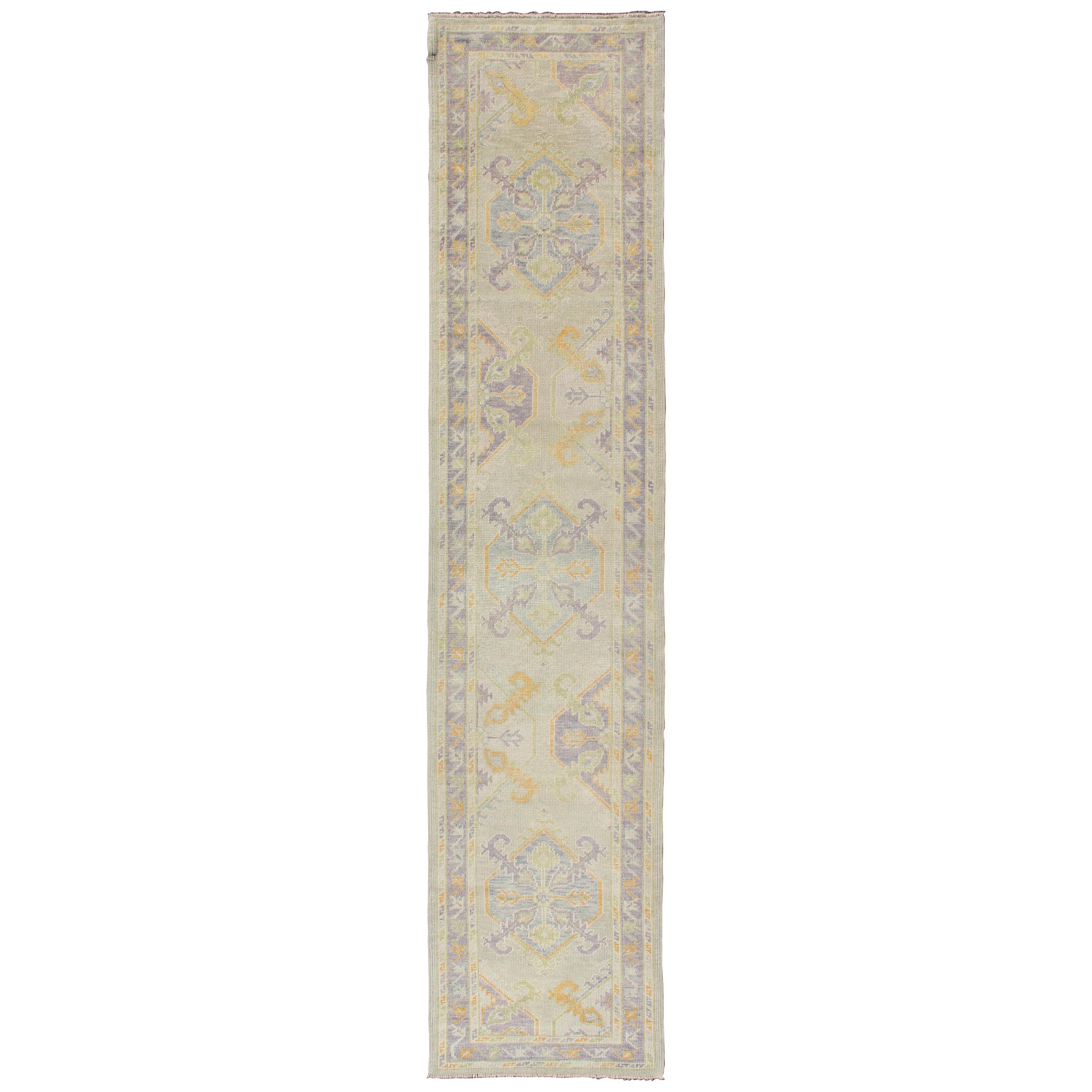 Turkish Oushak Runner with a Tribal Design in Purple, Blue and L.Green Colors  For Sale