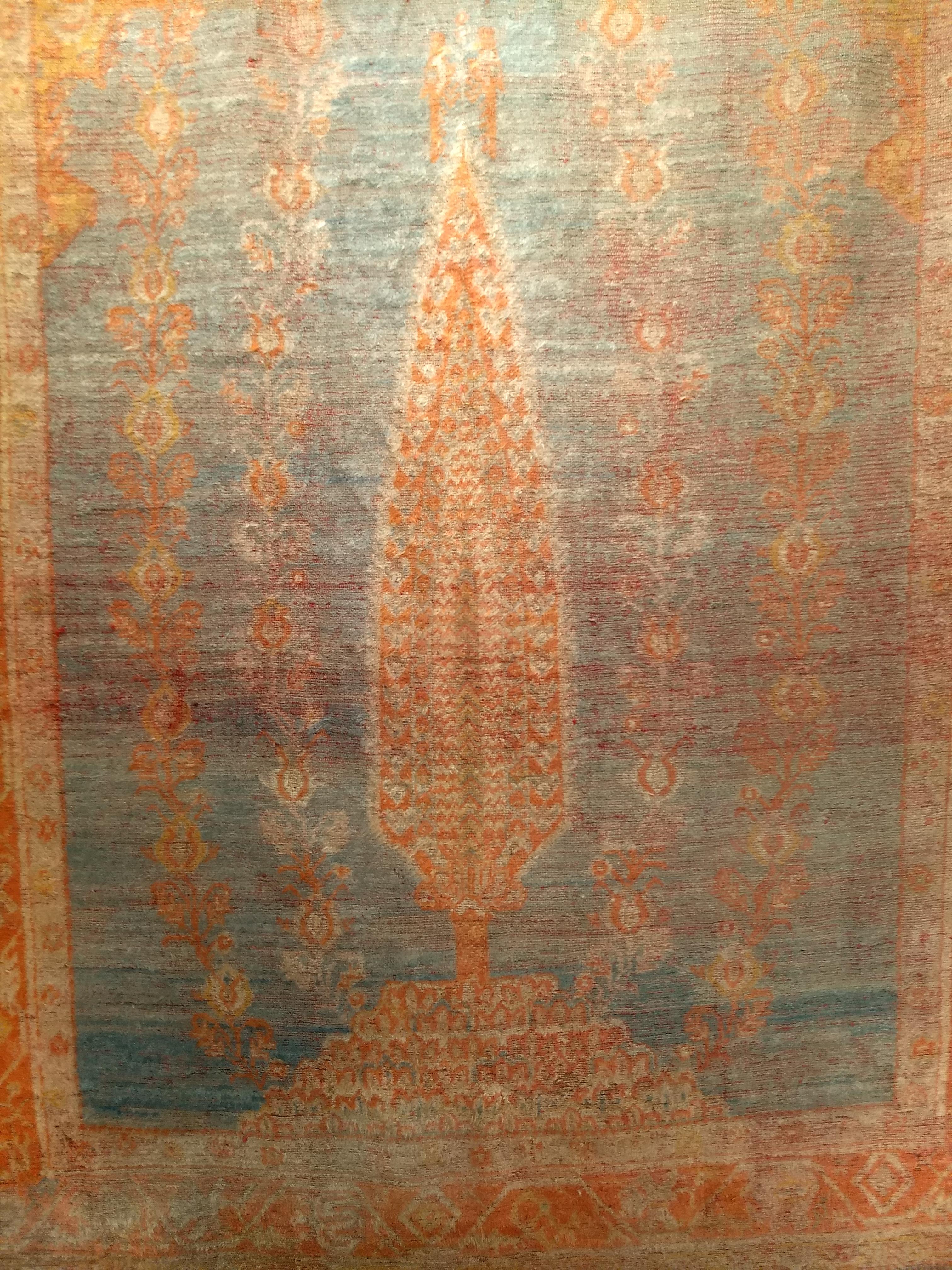A 19th century Turkish Oushak room size rug in 