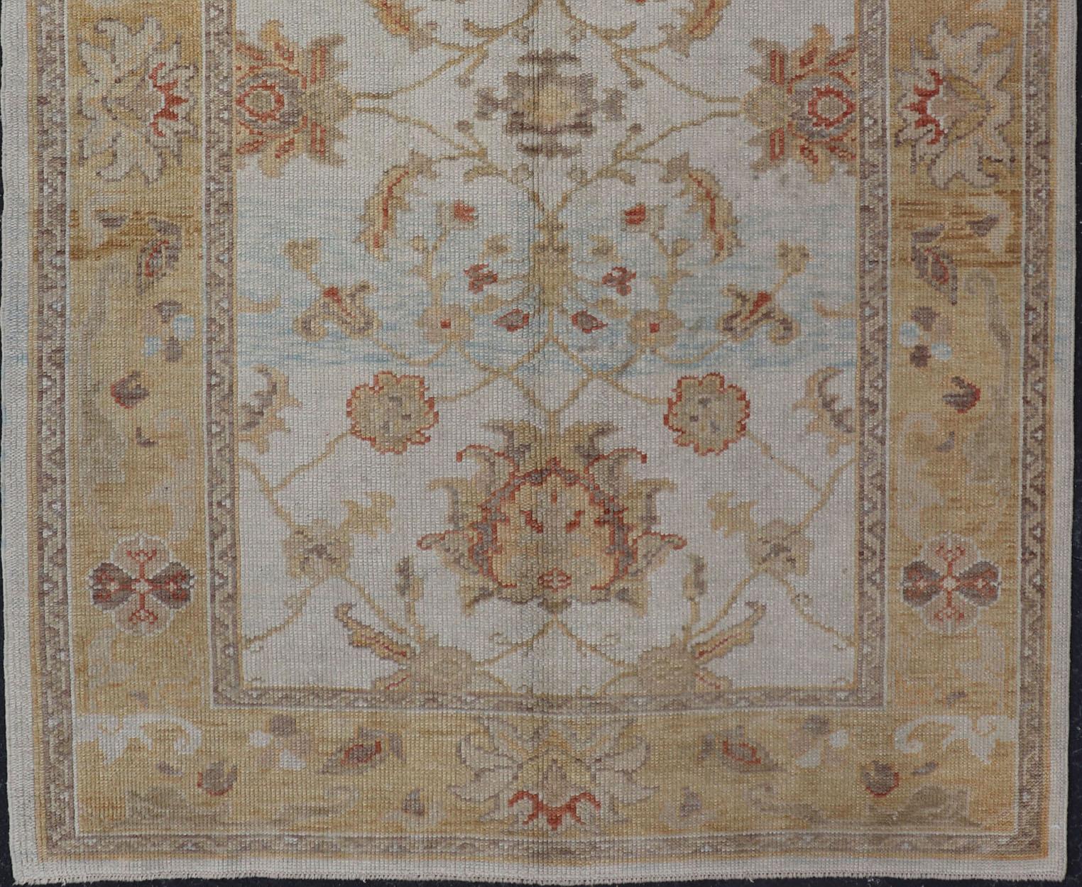 Stylized Reproduction Oushak rug from Turkey, Keivan Woven Arts, rug EN-115469, country of origin / type: Turkey / Oushak, circa 2000

This reproduction Turkish Oushak rug features a stylized vining floral design. The multi-tiered border features