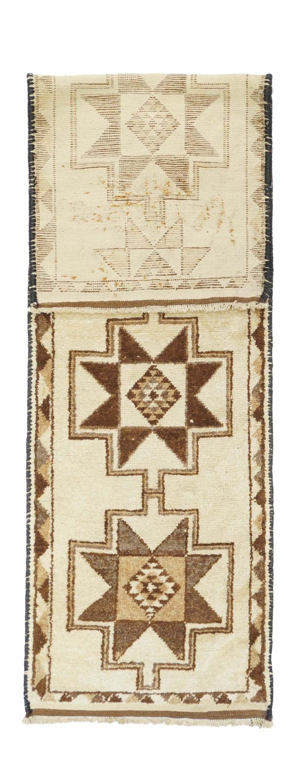Turkish Rug 3'0'' x 10'7''. In the blue-and-white style with a round, densely fretted medallion incorporating four dragon heads, and numerous secondary paeony and other seasonal floral sprays. Openwork floral arabesque corners. Ecru main border of