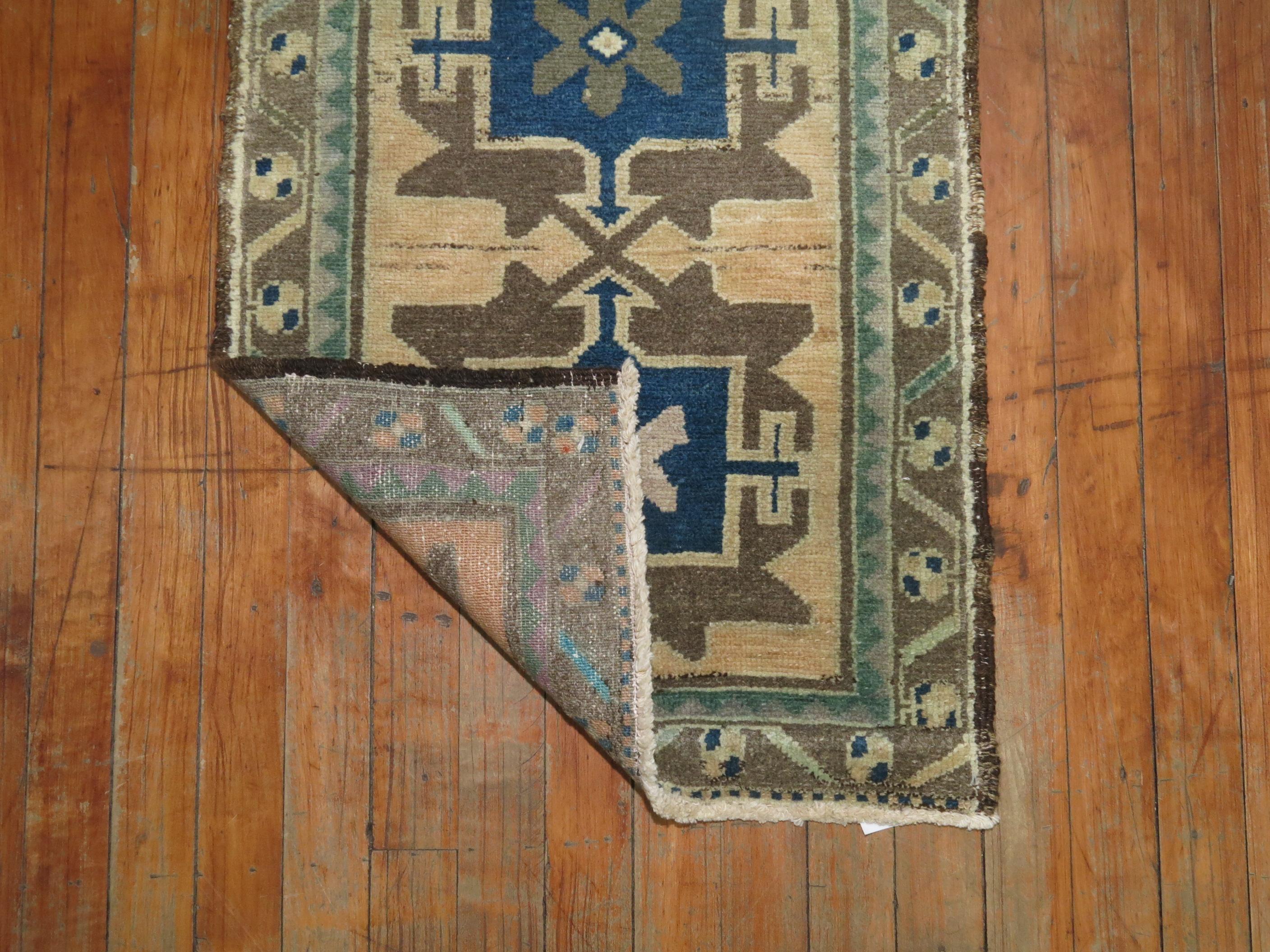 A one of a kind vintage Anatolian Turkish rug. Blues, green and beige.