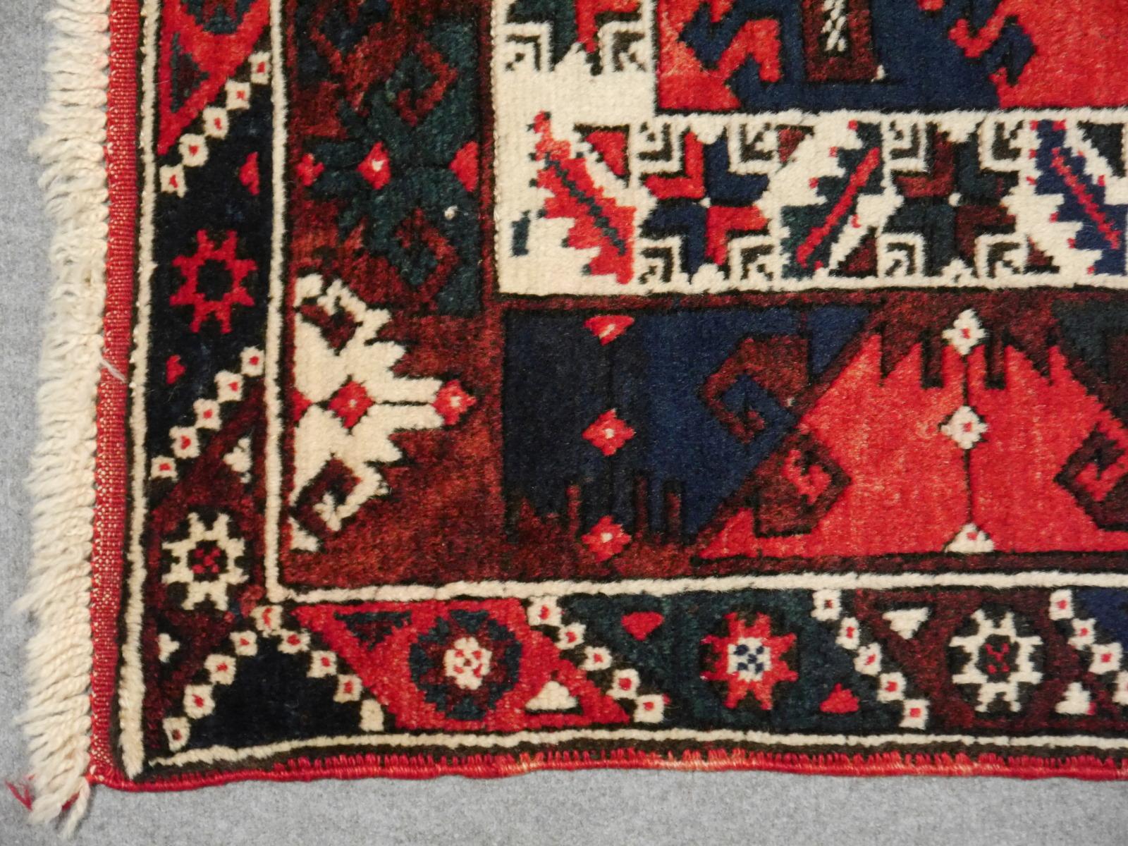 Vintage semi antique oriental accent rug, carpet or mat.

Vintage Turkish rug excellent condition, nice colors. This rug was hand knotted in the village of Dosemealti, It has an pretty red field with blue and beige traditional motives. The fringes