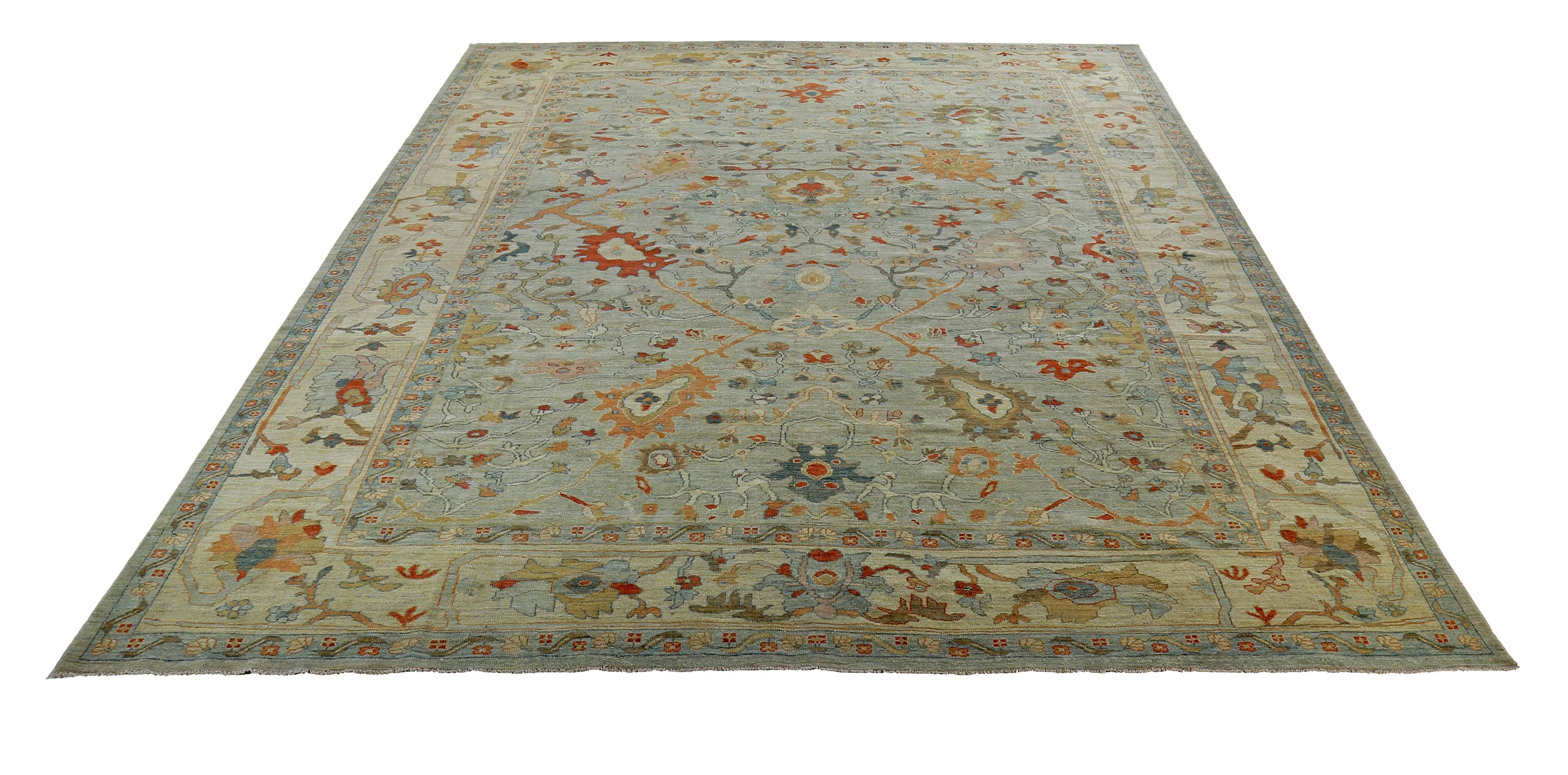 New handmade Turkish rug from high quality sheep’s wool and colored with eco-friendly vegetable dyes that are proven safe for humans and pets alike. It’s a Classic Sultanabad design showcasing a lovely gray field with prominent Herati flower heads