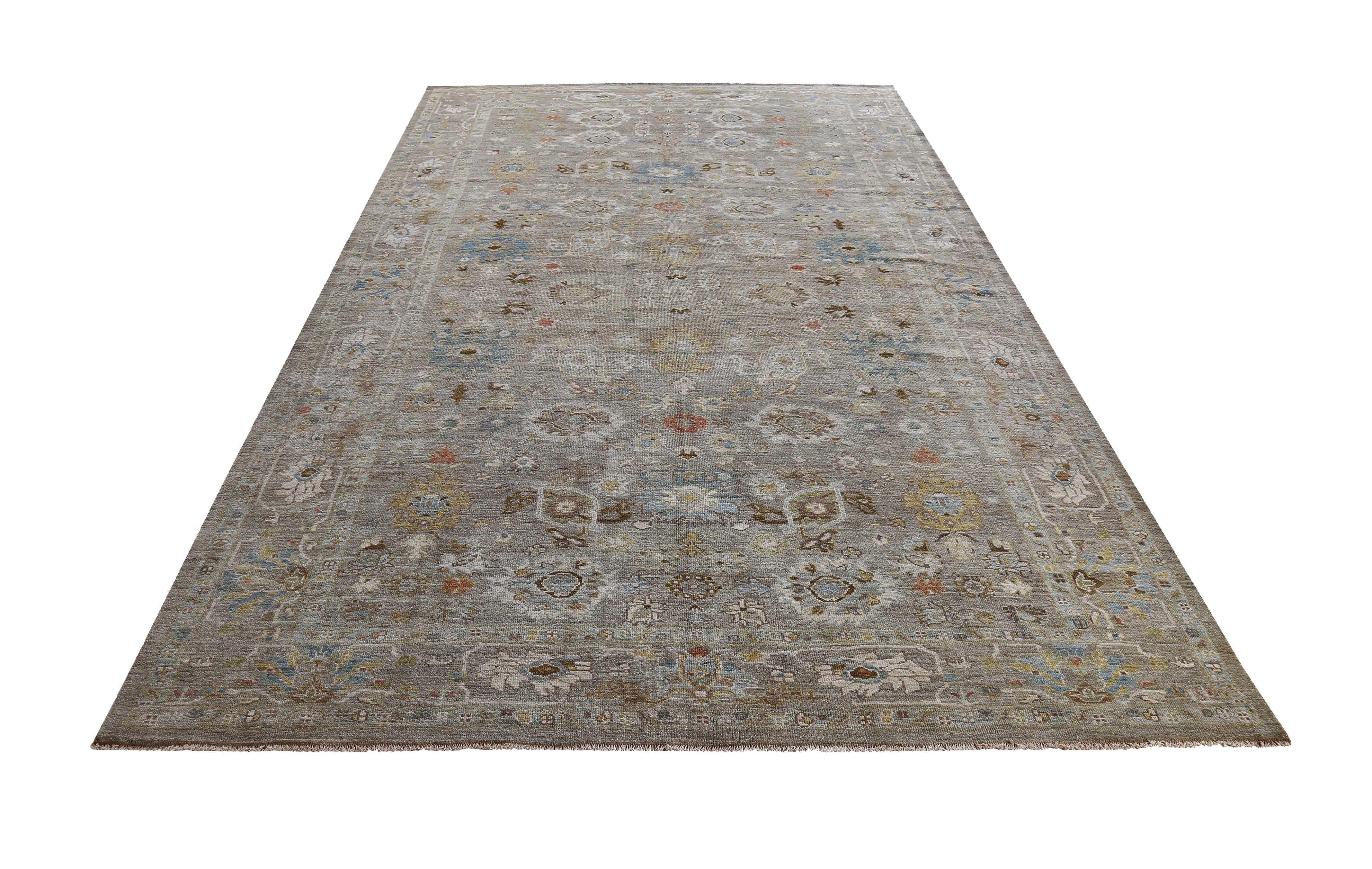 New handmade Turkish rug from high quality sheep’s wool and colored with eco-friendly vegetable dyes that are proven safe for humans and pets alike. It’s a classic Sultanabad design showcasing a lovely gray field with prominent Herati flower heads