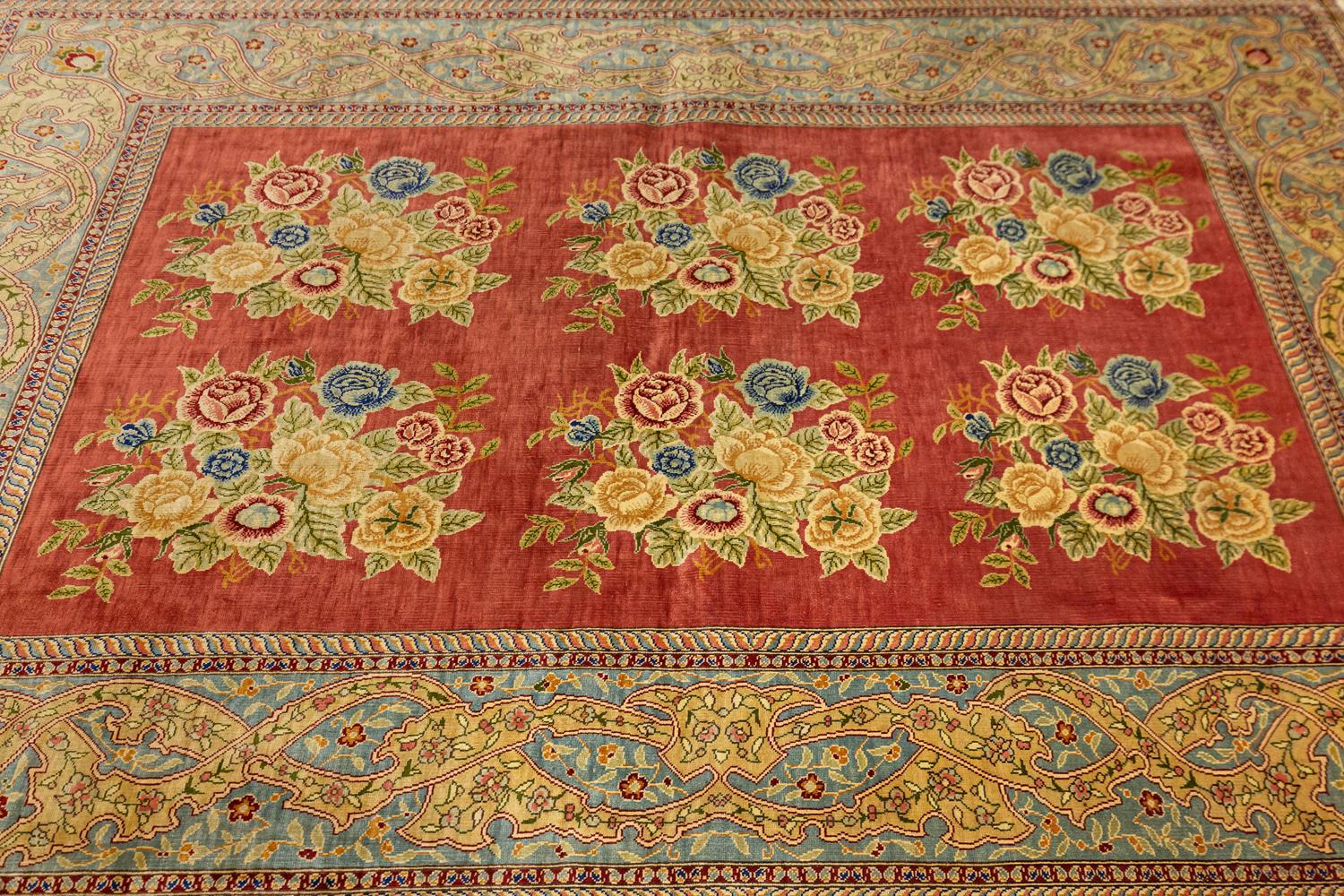 This is a semi-antique Hereke silk and metal threaded rug woven in Turkey during the last quarter of the 20th century circa 1970-2000's and measures 141 x 90CM in size. Its field is made up of two rows of bouquets with different blossoming flowers