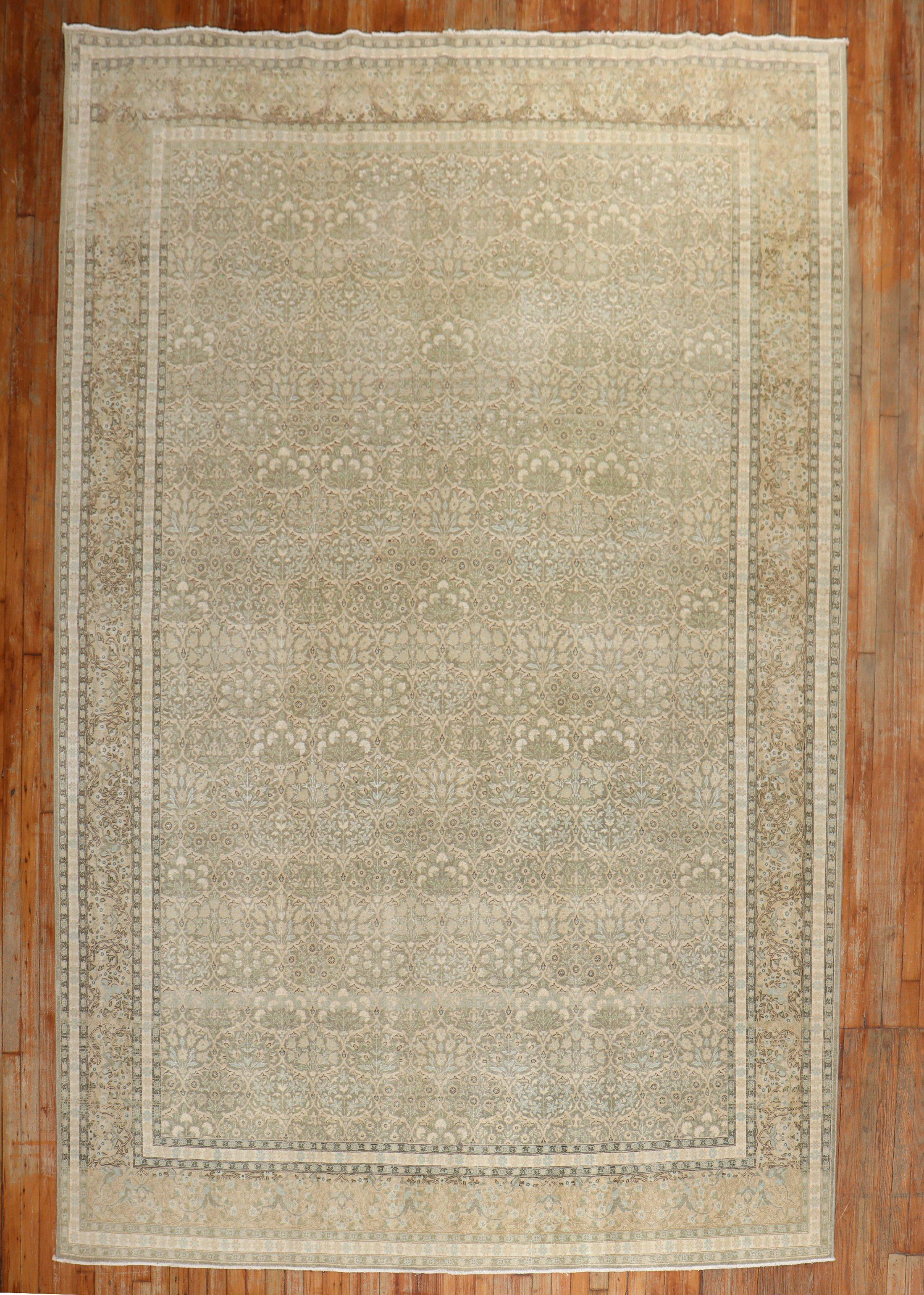 A mid 20th century Persian Tabriz  floral pattern rug in neutral tones

Measures: 7'10'' x 11'3''.