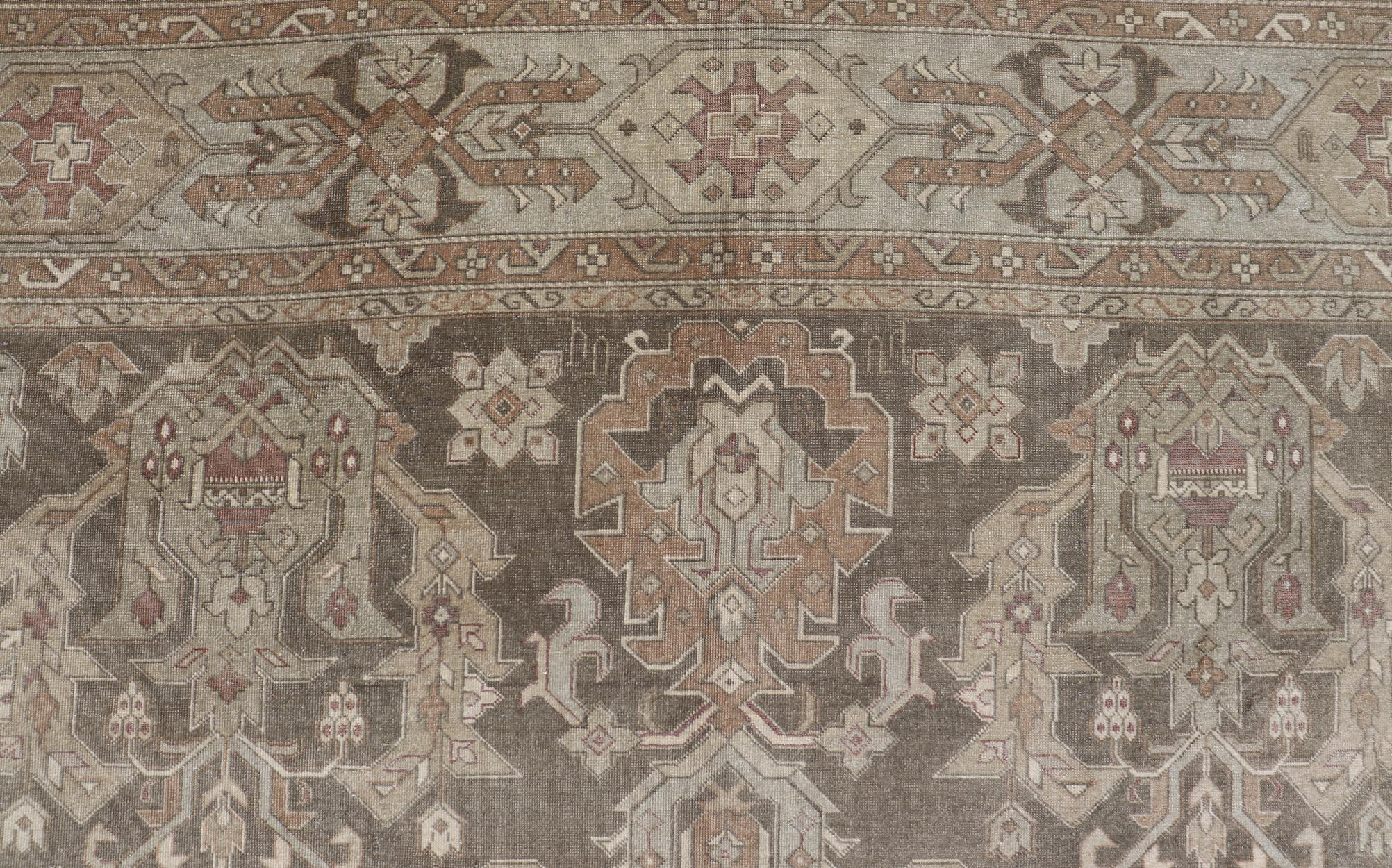 Turkish Sivas Rug with Tribal Motifs in Brownish green, L. green & multi tones. Country of Origin: Turkey; Type: Sivas; Design: Floral, All-Over, Tribal; rug EN-15184; Wool Sivas Vintage Turkish Area Rug

Measures: 10'5 x 12'11 

In this 1930s