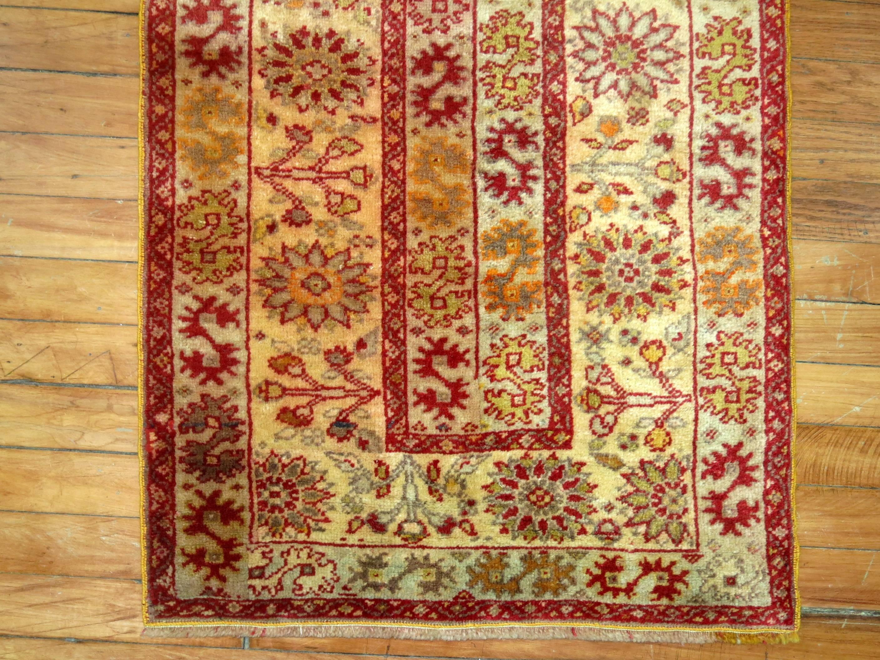 A fine narrow and small Turkish Sivas runner in rich red and gold tones.

2' x 6'5''