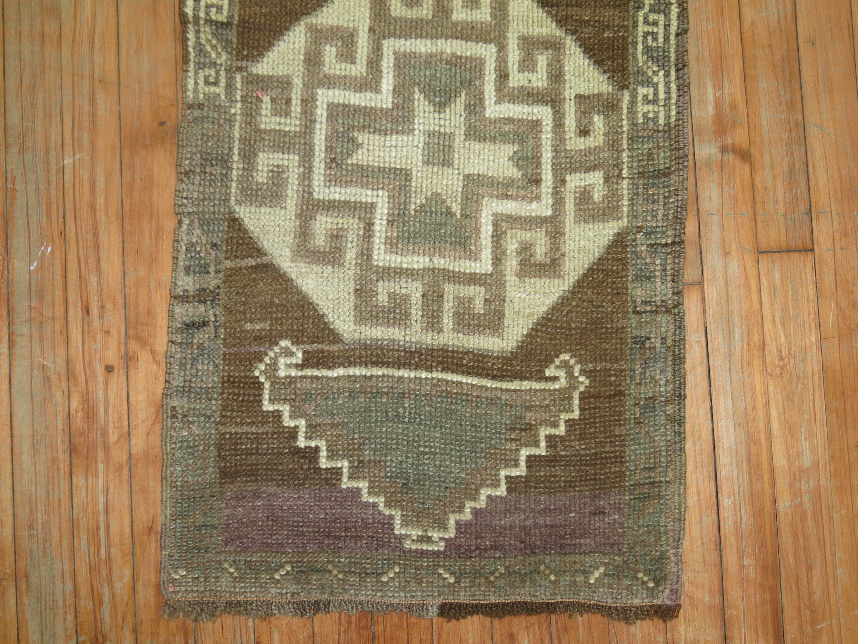 Vintage Turkish rug with an oatmeal brown field.