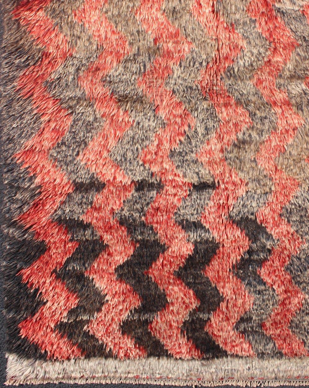 Vintage Tulu Carpet with Zig-Zag Stripe Pattern in Gray, Charcoal and Red

Measures: 3'3 x 4'10.  

Turkish Tulu Carpet with Moroccan design in rows of Zig-Zag. Keivan Woven Arts/ rug#EN-140793, origin/turkey
This high pile shaggy Tulu rug is