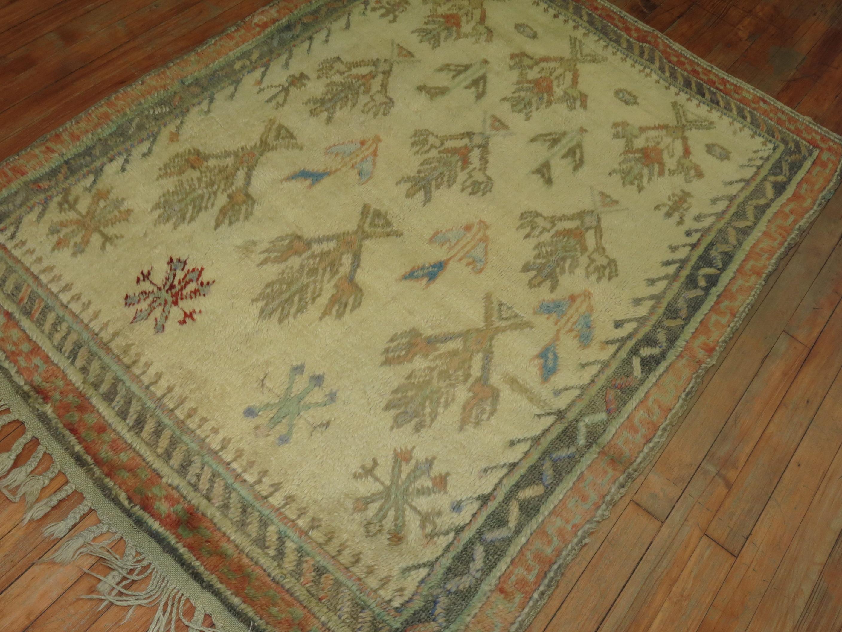 One of a kind Turkish Tulu rug with a repetitive branch design throughout on an ivory field, circa 1950s.