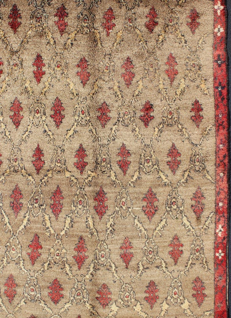 Hand-Knotted Mid Century Tulu Carpet in Sand Color Background For Sale