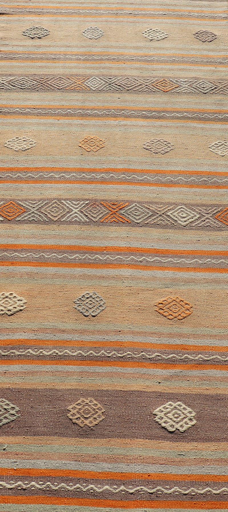 Wool Turkish Vintage Flat-Weave Kilim in Muted Colors with Stripes and Embroideries For Sale