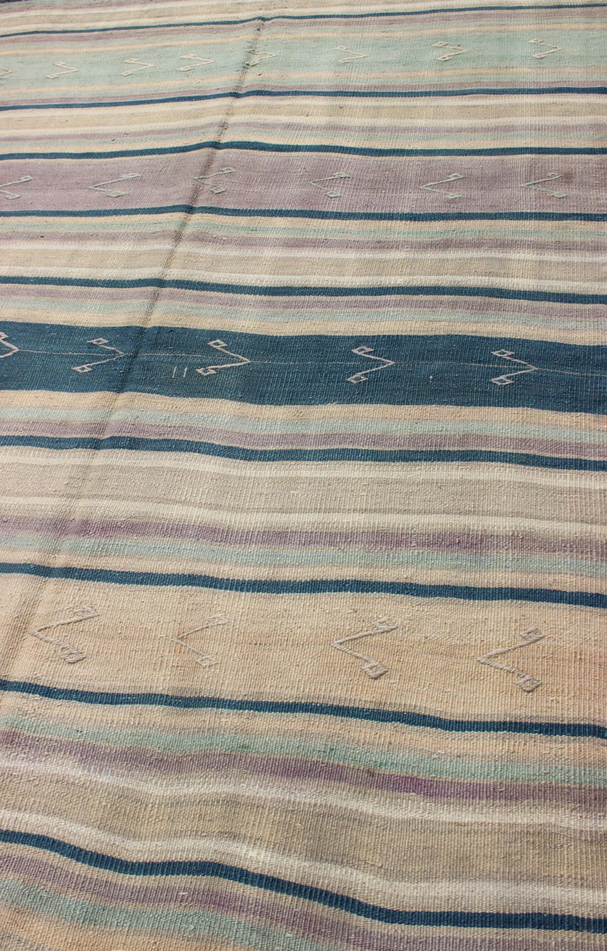 Wool Turkish Vintage Flat-Weave Kilim with Striped Design and Tribal Motifs For Sale