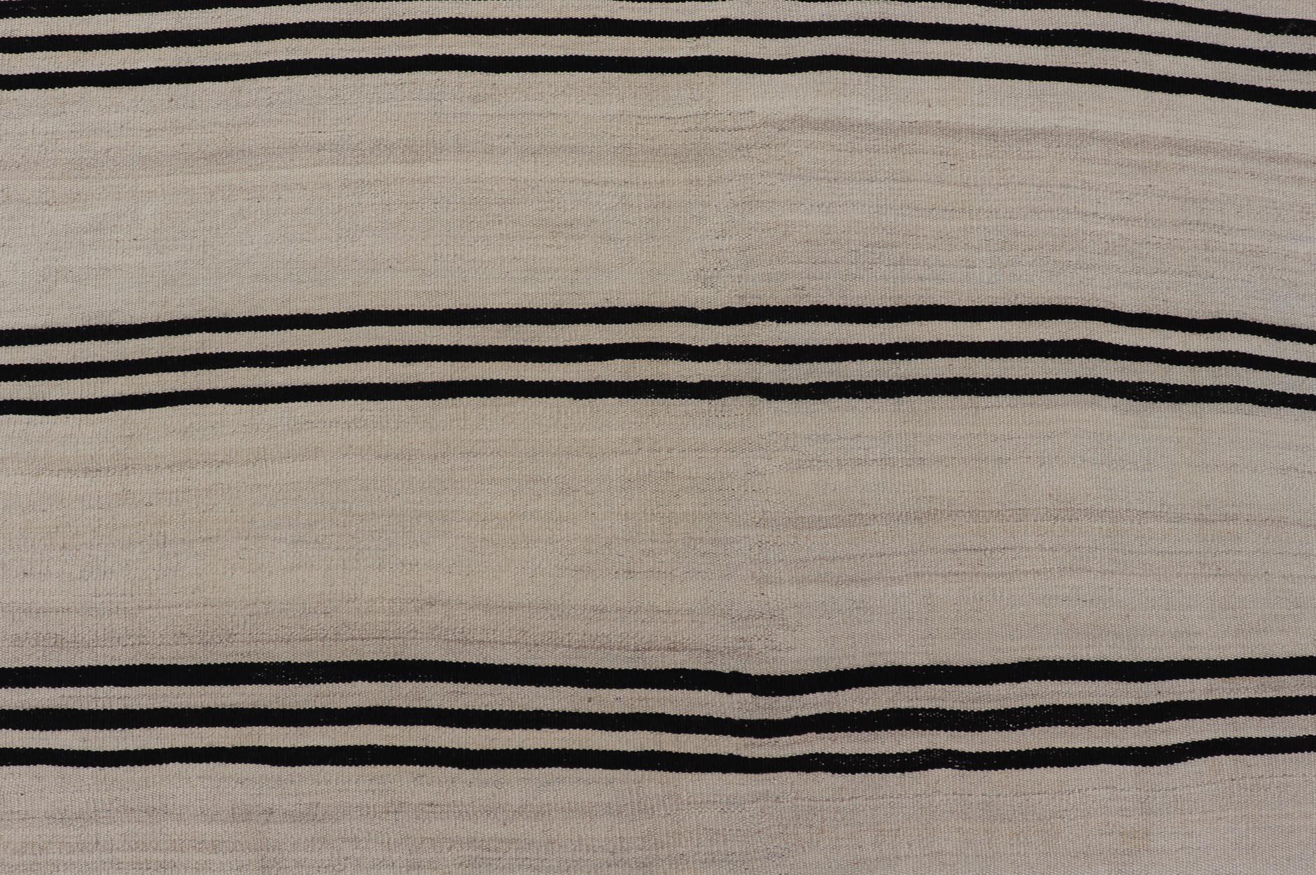 Turkish Vintage Kilim Flat-Weave Rug in Brown and Cream with Stripe Design. Keivan Woven Arts / rug EN-15166, country of origin / type: Turkey / Kilim, circa 1950 
Measures: 4'5 x 6'0 
This vintage striped design Turkish Kilim rendered in shade of