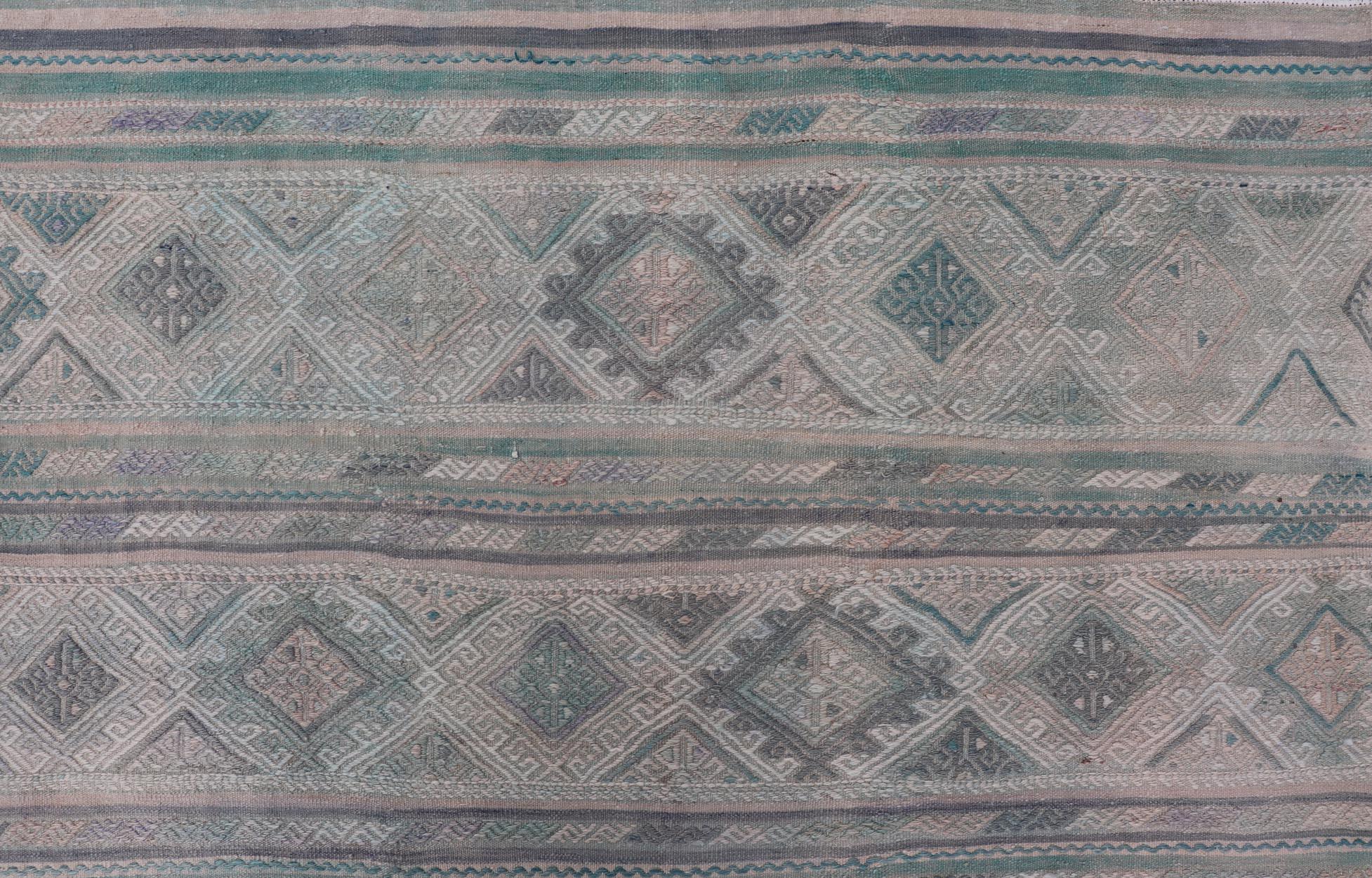 Turkish Vintage Kilim Flat-Weave with Embroideries Kilim in Pastel Color. geometric stripe design Vintage Kilim from Turkey, Keivan Woven Arts / rug EN-14029, country of origin / type: Turkey / Kilim, circa 1950
Measures: 5'4 x 7'7 
